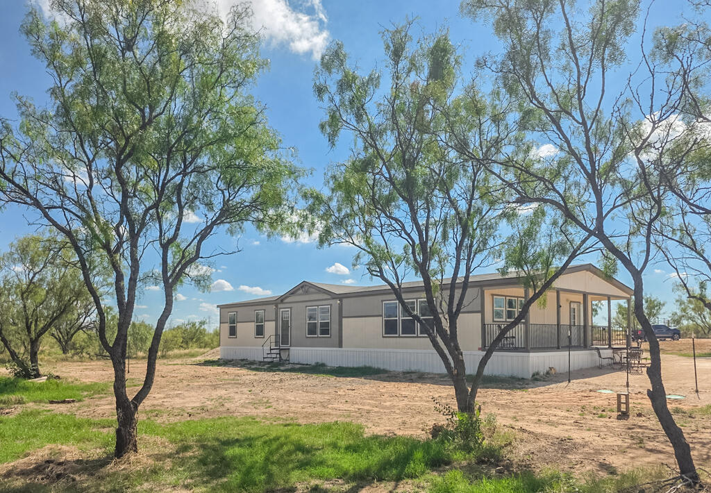 This beautiful 2.5 year old home has almost 2300 square feet, 8 acres, 4 bedrooms, 2 baths and a gourmet kitchen & a huge island. It is located in Greenwood School District and only 8.5 miles to the school and 7.6 miles from Greenwood Fire Station. It's in a heavily treed area with rabbits, horny toads, butterflies, quail, dove and blue heron. New septic was just installed.  Well is 20 GPM and recently tested by JR's Well Service.  This property feels like a nature preserve with very old and tall mesquite trees.  If you want a quiet, secluded area for you and your animals to live this is it!