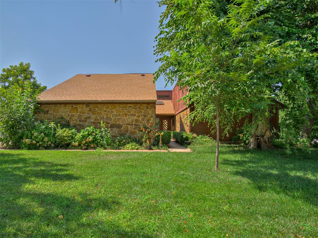 Are you in love with the character and charm of a Mid Century home? If you are, this one is the one for you! It's like stepping back in time when you walk in the front door. Leaving so many options to make it your own! From the floor to ceiling stone fireplace to the sunken living room, and the wet bar, this home is just groovy! We are aware that this home needs lots of love and updating to be current. If you want to get a home with all the character before its updated to a blank slate this could be the one for you!