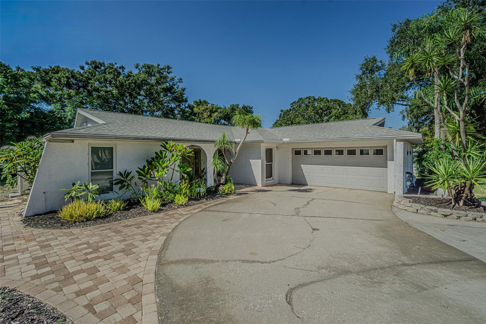 Welcome to your dream home in the heart of Palm Harbor! This Completely renovated four-bedroom, tow-bathroom open layout and move in ready residence with a dedicated home office is perfect for modern living. Nestled in the sought-after Westlake Village, this property boasts a prime location just behind the highly acclaimed Palm Harbor University, one of the top schools in Pinellas county. Step inside to discover a beautifully updated interior featuring luxury flooring throughout creating an airy and contemporary atmosphere. the heart of the home is the gourmet kitchen, equipped with stunning quartz countertops and a sleek cabinetry, perfect for culinary adventures. This home is a tech lovers paradise, featuring brand new Samsung smart appliances, including a refrigerator, washer and dryer set. Enjoy movie nights in the spacious living room with a 75-inch Neo QLED TV, expertly mounted for your viewing pleasure. The main living areas are enhanced with Lutron Caseta smart lighting, allowing you to customize ambiance at the touch of a button. Convenience continues with a Google Nest smart front door lock and a wireless access point port in the living room for seamless device connectivity. The property is designed for comfort and efficiency, featuring hurricane impact windows throughout most of the home, providing both security and energy savings. Located just a stone throw away from the world-famous Dunedin Causeway and a variety of shopping options, this home offers the perfect blend of tranquility and accessibility. Don't miss the opportunity to own this extraordinary property in one of Florida's most desirable neighborhoods. Schedule your private showing today!