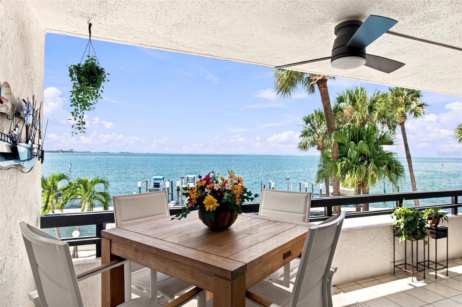 Wake up to one of the most spectacular views in Tampa. This rare waterfront condo looks directly across Tampa Bay, with downtown St. Petersburg sparkling in the distance. This is one of the most unrivaled views in Tampa. Step inside and discover a beautifully appointed residence featuring three private patios—perfect for morning coffee overlooking the water, or simply soaking in the Florida sunshine. The interior is thoughtfully decorated in a sophisticated Italian style, with refined finishes and warm, inviting details that create an atmosphere of timeless elegance. Completely move-in ready, this condo requires nothing more than your personal belongings. Every detail has been carefully considered so you can begin enjoying the ultimate Florida waterfront lifestyle right away. With boat lifts right at your doorstep, you can be on the water in minutes—cruising across Tampa Bay, exploring the Gulf, or heading out for a sunset cruise. Located on a quiet end street with no through traffic, the condo offers peaceful privacy while still providing quick highway access and top-rated school districts. If you’re ready to embrace effortless bay living, this is the opportunity you’ve been waiting for.
