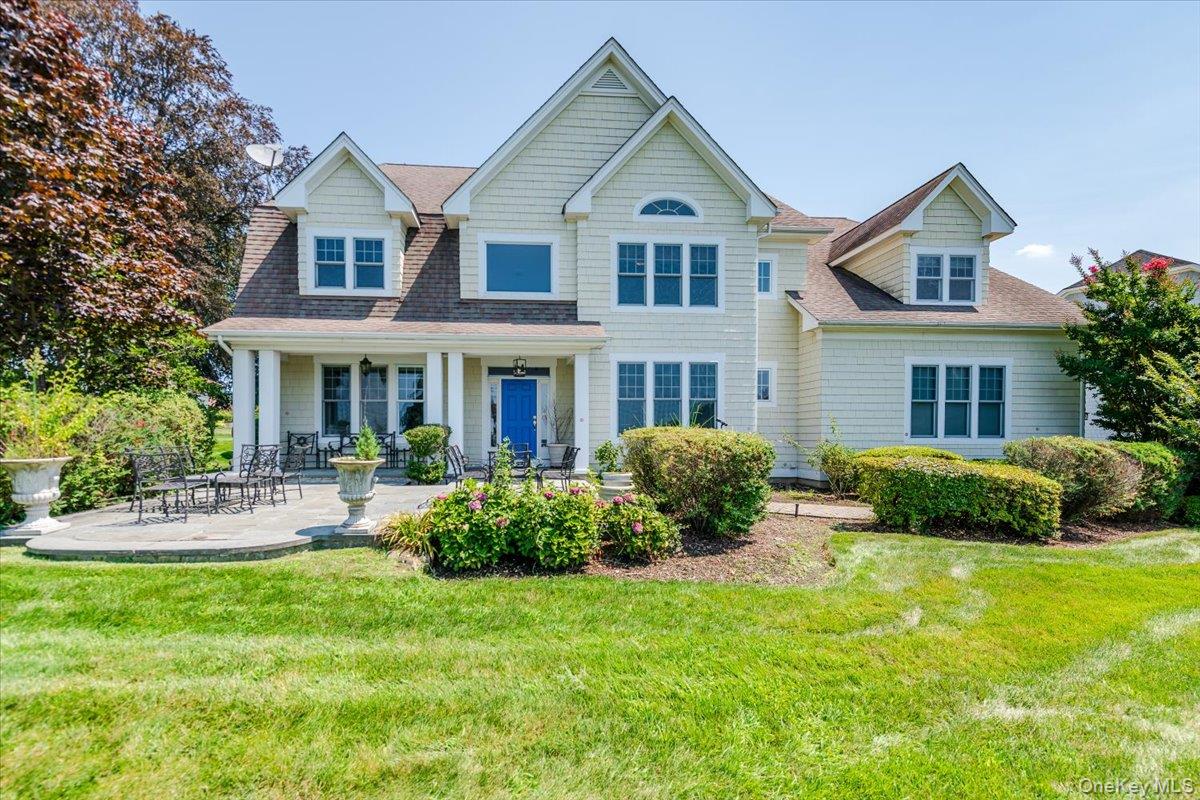 Glen Cove | Privacy, Security, and Coastal Living combine at 53 Pembroke Drive in the Legend Yacht and Beach Club. This stunning coastal colonial home offers a 3,800 sf.+ resort-like lifestyle with double water views - of the Long Island Sound and a calming pond & fountain right in your backyard. Gently sitting atop of a hill in the center of this waterfront community, the home provides four spacious bedrooms, four & a half bathrooms, lofty two-story spaces, including the great room, two fireplaces, and a bright & welcoming kitchen adorned with top-of-the-line appliances. Additionally, the home offers a finished basement, two-car garage, and allows its owners to enjoy year-round sunsets from the comfort of their home. The community itself offers 46-acres of security and waterfront comfort for its residences. Cool off during the warmer months at the heated, in-ground pool and resident cabana. Enjoy the private marina and beach, and entertain in the rustic, boat-house style clubhouse.