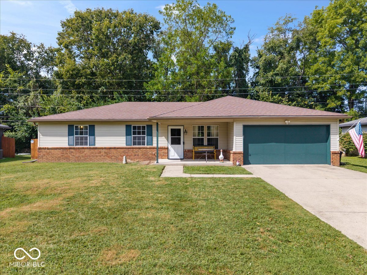Discover the ease of single-story living in this inviting ranch siting on a private lot. This charming 3-bedroom 2 full bath home, providing a perfect foundation for your next chapter.  The heart of the home, the kitchen, is thoughtfully equipped with newer appliances, updated faucet, and new flooring creating a cohesive and functional space for everyday meal preparation.  This property features three comfortable bedrooms and two full bathrooms, accommodating diverse needs. Enjoy the convenience of a dedicated laundry room, simplifying daily chores. An attached garage provides secure parking and additional storage, while a welcoming porch offers a pleasant spot to relax. The private fully fenced in yard offers a mini barn for storage and opportunities for outdoor enjoyment and personalization.