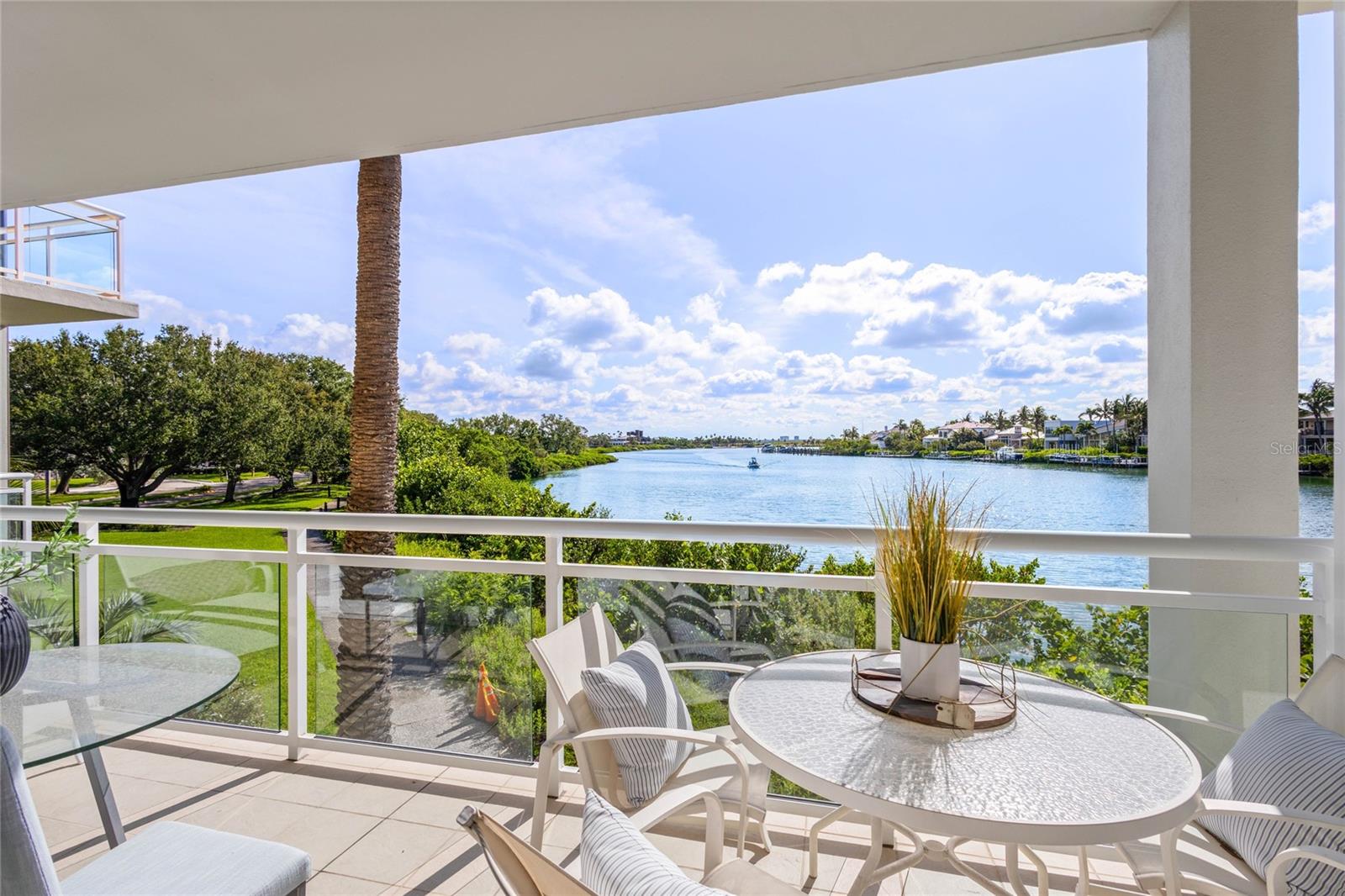 The most perfectly peaceful lagoon views are enjoyed from this first floor Junior Suite in Building 6. Unlike the other buildings, this building boasts 10' ceilings making it feel especially spacious while optimizing natural light and view. It is typical to see manatees, dolphins, paddleboarders and a variety of tropical birds from the terrace overlooking the turquoise lagoon water. Building 6 offers extra privacy as it is located across the street from the main entrance, but still close enough to enjoy the pool and beach without having to pack the car and drive anywhere. Updates to the residence since purchase include new washer/dryer, new dishwasher, new microwave, new glass shower doors, new commode, new closet shelving, and new fire alarm. This unit is not part of the hotel program; however, it can be rented out by the owner or a 3rd party vendor on a nightly basis. Owners can also become members of the Longboat Key Club to partake in the numerous Resort amenities (Golf, Tennis, Restaurants, Fitness Center, Marina) if they still want to enjoy the benefits of owning in a Resort community without being part of the hotel program.
