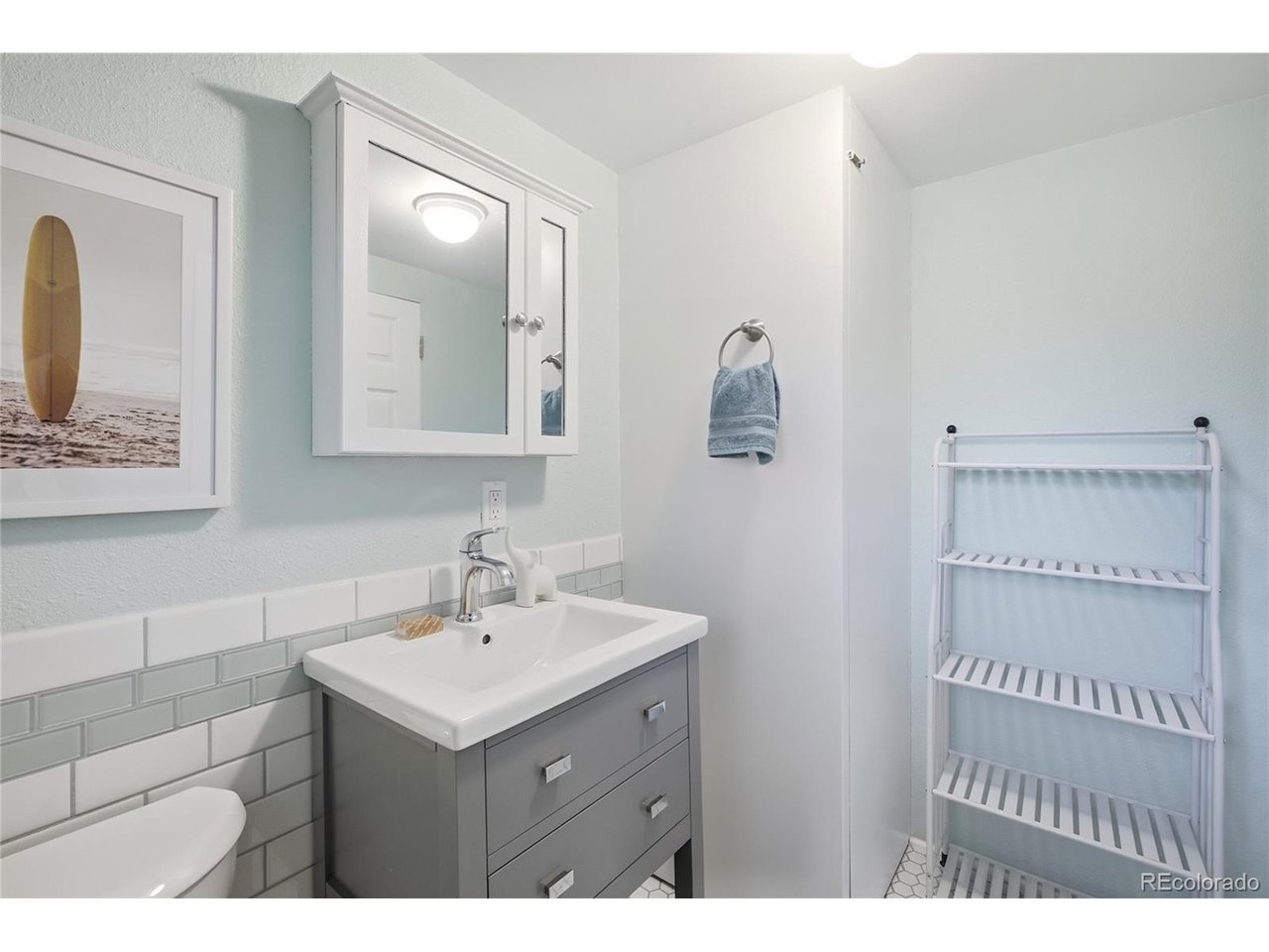 This timeless, remodeled Mid-Century Modern home features clean, minimalist lines and an iconic tri-level design that is truly not to be missed... Key improvements include a sewer line replacement (2023), a new water heater (2023), a recently remodeled downstairs bathroom, and new plumbing in the bathrooms (excluding the upstairs shower). The home also features a newer furnace, AC, roof, and windows, ensuring peace of mind for years to come.Inside, you will find a bright, inviting floor plan filled with natural light. Upon entry, floor-to-ceiling windows bathe the living area in warmth, while the layout flows seamlessly into the kitchen and dining space. The downstairs family room offers a cozy fireplace, the third bedroom, and direct access to the yard. The upper level hosts two bedrooms and the primary bathroom. Outside, the private, fenced-in yard is perfect for gardening or hosting, complemented by an attached garage.Located on a quiet street, this home is just blocks from the Clear Creek Trail system, offering miles of walking and biking that connect to Golden, the South Platte River Trail, Downtown Denver, Wash Park, and Cherry Creek. This is within the scenic 300-acre Wheat Ridge Greenbelt. Plus Anderson Park a few blocks away, which features a sports field, a playground, and a pool. With close proximity to Old Town Arvada, the Wheat Ridge Rec Center, and easy access to I-70, this home offers the perfect balance of mountain convenience and city accessibility.