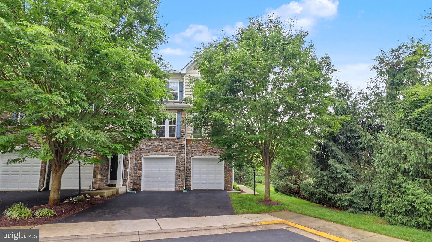 Stunning End-Unit Townhome Just Steps from Brambleton Town Center!Welcome to this beautifully positioned 3-bedroom, 2.5-bath end-unit townhome in the heart of sought-after Brambleton. Offering an exceptional combination of location, lifestyle, and outdoor living, this home features a 2-car garage, abundant natural light, and a rare three private outdoor spaces — including a private deck off the primary suite.Enjoy an open, functional layout designed for today’s lifestyle with comfortable living spaces perfect for everyday living, entertaining, and working from home.Step outside and enjoy the added privacy and flexibility that make this property stand out from the competition.Located just moments from Brambleton Town Center, you'll love having shopping, dining, entertainment, parks, trails, pools, and community amenities practically at your doorstep.Whether you're looking for convenience, community, or low-maintenance living in one of Loudoun County’s most desirable neighborhoods — this home delivers.Live where everything is at your fingertips.