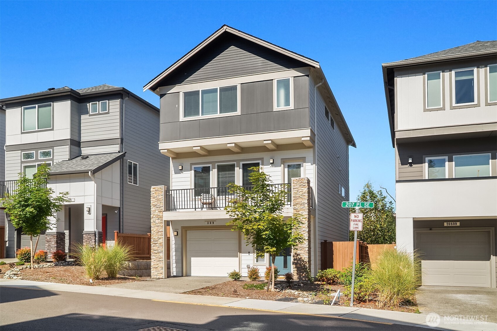 Located in the Northshore School Dist with 4 bedrooms, including 2 primary bdrms with en-suites, one conveniently located on the entry level-ideal for multigenerational living. The open-concept design is perfect for entertaining, showcasing a commanding kitchen island, high-end appliances, a dining space, office area and a spacious living room with an expansive wall of south-facing windows complete with door access to a charming deck. Upstairs boasts 3 additional bdrms, 2 bathrooms, laundry, and a luxurious primary suite with a generous walk-in closet & a spa-like 5-piece bathroom. Low-maintenance backyard next to a tranquil greenbelt, perfect for gardening, play, or simply relaxing. Air Conditioning, garage and additional outdoor parking.