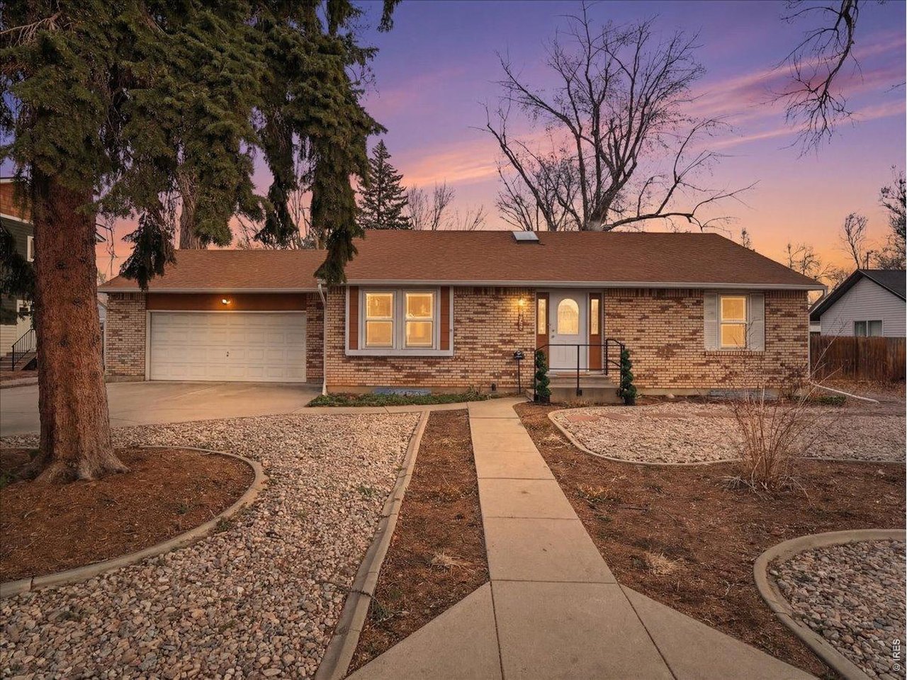 Location, location, location! Don't miss this rare opportunity to own a 3-bedroom, 2-bath ranch home in downtown Loveland with alley access, heated shop and room to park your RV, trailer, or recreational toys. The main level features an updated kitchen with newer cabinets and granite countertops, opening to a bright living room highlighted by a picturesque windows. Two bedrooms are located on the main floor, including the primary bedroom with a new door leading to a Trex deck, creating easy access to the backyard for relaxing or entertaining. The kitchen also offers direct deck access and a convenient natural gas BBQ, perfect for outdoor gatherings. The finished basement adds additional living space with a third bedroom, a renovated 3/4 bathroom, and a spacious rec room ideal for game nights, movie nights, or hosting friends and family. Car lovers, hobbyists, and those needing extra workspace will appreciate the attached 2-car garage plus an oversized detached heated shop (23' x 28') with alley access. Located just minutes from shopping, dining, parks, and everything Loveland has to offer, this property combines convenience, functionality, and rare storage space for vehicles and equipment. Tankless hot water heater; 2 newer electrical panels; new light fixtures and the list goes on! Schedule your showing today-homes with this combination of location, workshop space, and RV parking don't come available often!