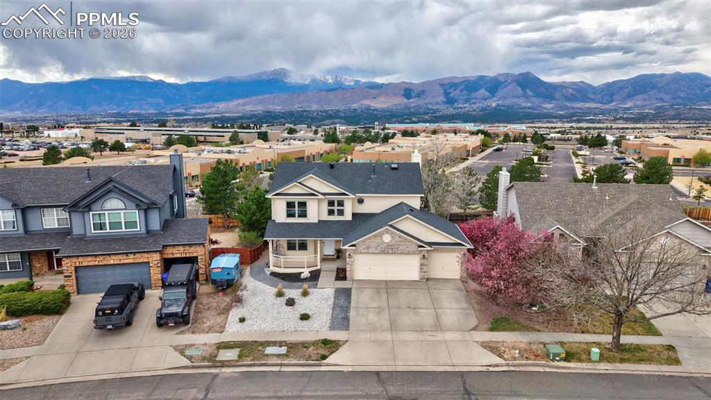 Set against the backdrop of sweeping Pikes Peak views, this beautifully reimagined residence at 2305 Wimbleton Ct offers an exceptional blend of modern design, comfort, and versatility in the heart of Briargate.Highlights include a fully remodeled kitchen with new appliances, contemporary finishes, and seamless flow into the main living area; a fully permitted fifth bedroom, thoughtfully added for flexibility; and a fully remodeled walkout basement with a kitchenette, private entrance, and dedicated living space—ideal for multi-generational living or guests. Expansive windows and outdoor areas continue to capture the stunning Pikes Peak views.The home features a cohesive, updated interior with new flooring, fresh paint, and modern lighting throughout. A custom-built entertainment center enhances the main living space. Additional updates include refreshed plumbing fixtures and finishes.Exterior improvements include a new roof and gutters, along with xeriscape front landscaping for low-maintenance curb appeal.Major system upgrades completed in 2024 include a new furnace, water heater, central air conditioning, and electrical updates.Located in the desirable Briargate community with convenient access to top-rated schools, parks, Powers Blvd, and I-25.