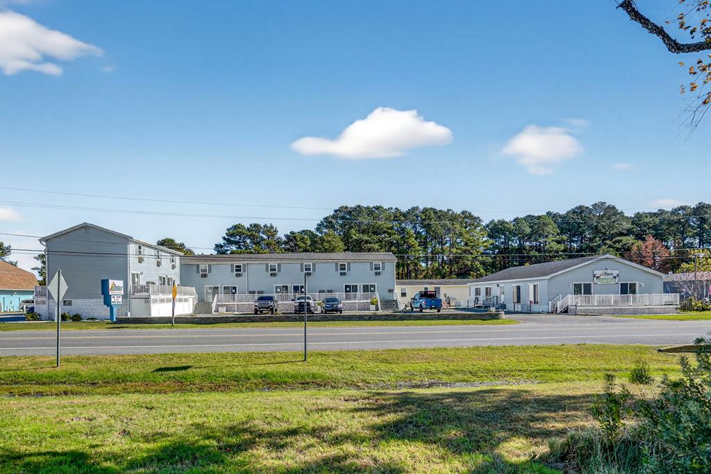 Exceptional Investment Opportunity! Discover The Reef Hotel, a boutique hotel on beautiful Chincoteague Island, VA- 1 mile from one of the most visited National Parks in the Country. This well-maintained hotel features 12 spacious villas & 2 charming guest cottages, offering a total of 14 income-generating accommodations. Guests can enjoy an indoor heated swimming pool, allowing the property year-round revenue. Ideally situated 1 mile from the National Wildlife Refuge & the pristine Assateague beaches, the property is centrally located on Maddox Blvd & all the Island's attractions. This is an outstanding opportunity for investors seeking an established & thriving hospitality business in a sought-after vacation destination. Don't miss out on this rare chance to own a premier property!