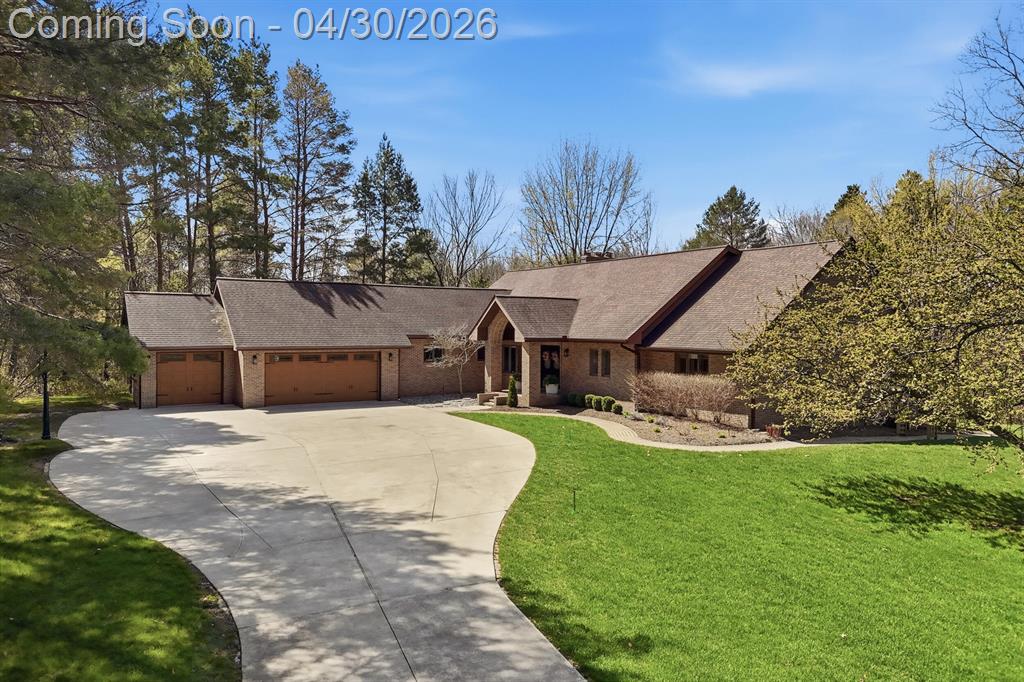 Escape through a private 'Tunnel of Trees' to discover a magnificent 5,800+ square-foot custom retreat hidden among 60-foot towering pines. This rare 15-acre wooded sanctuary offers the perfect blend of seclusion and everyday convenience, located just minutes from the airport and major commercial centers. Designed for comfort and luxury, the home features four bedrooms, three full baths, and three half baths. Modern amenities include a heated three-car garage, custom plantation shutters, and three distinct fireplaces. Recent upgrades such as brand-new gutters installed across the entire house in 2025, a French drain system added to the front of the home in 2023, and a new water heater in 2022 add value and peace of mind.Step inside to find an exceptional interior defined by 14-foot cathedral ceilings and 60 feet of west-facing Anderson window walls that frame brilliant natural views. The breathtaking entertainer's kitchen features cherry wood floors, Grabil hickory cabinets, anoversized granite island, and premium Subzero, Wolf, Viking, and Bosch appliances. A walk-in butler's pantry and dedicated coffee/wine bar make hosting simple. The kitchen flows into the spacious family room features soaring cathedral ceilings, skylights, and its own floor-to-ceiling brick fireplace, along with French doors that open directly to the massive back deck overlooking the serene woods. Adjacent, an expansive living room welcomes you with a wall of windows and another set of French doors leading out to the deck, plus a stunning floor-to-ceiling brick fireplace to complete the inviting space. The first-floor primary suite serves as your personal oasis, complete with a private deck and a luxurious 200-square-foot spa bathroom featuring a soaking tub, tiled shower, and dual vanities. The main floor also includes a massive 250-square-foot laundry and storage room designed for ultimate convenience and flexibility. Upstairs, you will find two spacious bedrooms and a full bath, alongside a cozy sitting room with a fireplace and built-in