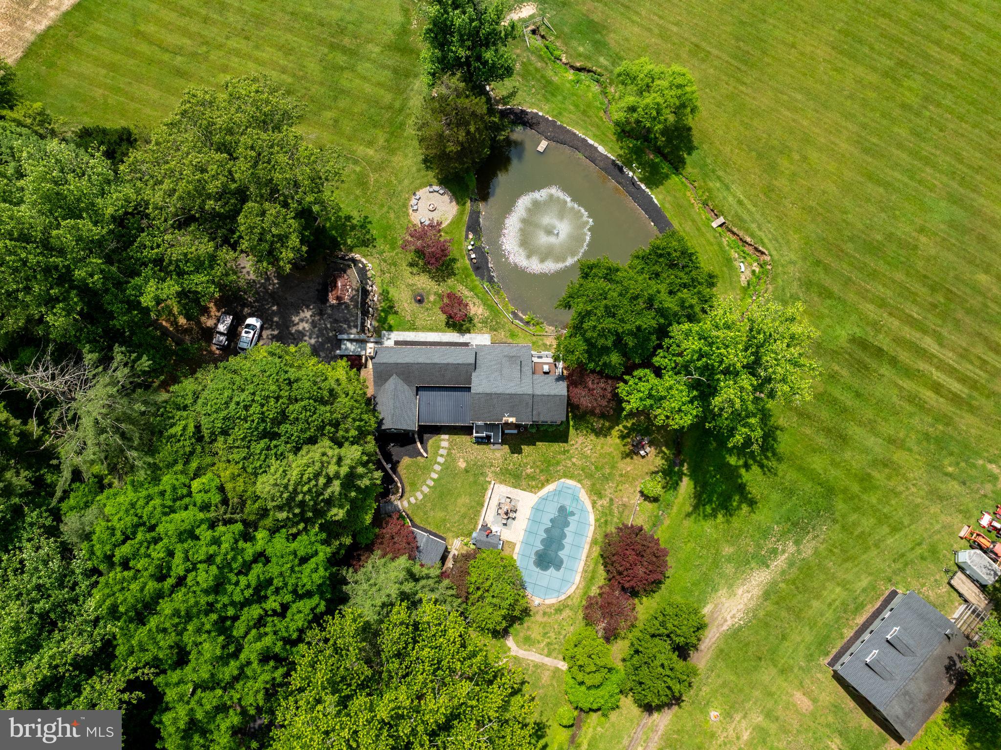 Can you hear the calm?? 23 Acres of nature, tranquility and peace in Forest Hill/Fallston area in Harford County. Updated 1910 Farmhouse with additions totaling 3500 sq ft+- of living area. Contractors, Fishermen, Hunters, Equestrians, Nature Lovers Delight! Extended family? This one can certainly accommodate. Main Level Boasts Gorgeous cooks Kitchen, Pantry, Formal Dining Room, Formal Living Room with exposed beams and Fireplace, Family Room which opens to a Bright Sunroom and walk out patio/deck overlooking pond with fountain, Main level Primary Bedroom and Bath, and a powder room opening to the exterior for pool lovers use. Second floor offers room for extended family to have own space 2 Bedrooms with their own full baths, a sitting room and a bonus room. Exterior features include Inground pool with pool house/extra Bedroom, 2+ car garage with separate office/living space, Machinery shed, 4 stall Horse barn with tack and feed room plus a loft, Hunting shed down by Winters Run creek with own outhouse (potential vacation rental income?), Pond and more++++ Property is bordered by Winters Run Creek, and 500+ Acres of Hunting Farm/Equestrian.  Hip Camp opportunity? Shiloh Valley Campground. Potential for another building site?? Sellers upgraded septic and drain fields to potential accommodate? Buyers to verify with county. Schedule your private showing.