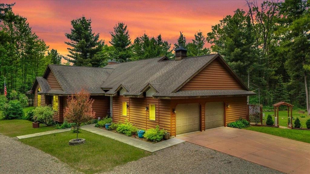 Custom Cedar home nestled among mature trees, this home showcases timeless cedar siding and beautiful real wood flooring. The well appointed kitchen features stainless steel appliances, solid surface counter tops, abundant cabinetry, a pantry making it perfect for everyday living or entertaining. The spacious master bedroom offers a peaceful retreat with an ensuite, double sinks and walk in closet. Ample storage throughout this home. Relax in the family room with cathedral ceilings and a real wood burning fireplace. Enjoy the changing seasons from the comfort of the screened in three season room , ideal for morning coffee or relaxing evenings, Anderson windows throughout the home with plenty of natural light, attic exhaust fan for energy efficiency. This home is a blend of comfort, craftsmanship and natural beauty. Fenced in garden area for all your vegetables; enjoy the abundance of fruit trees - apple, pear, plum, grapevines, and raised beds for ease of harvest! Plenty of wood in the wood shed for the fireplace or firepit. Generac generator to give you peace of mind in every season!