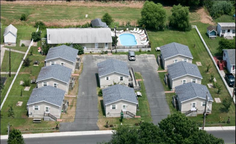 INVESTMENT ALERT! Steve's Cottages opened in 2002. Located one street over from a primary commercial Blvd. Eight turn key cottages of 576 sq ft each with open space kitchen/living room, full bath & one bedroom with a bonus room, currently setup as 2 bedrooms. Each cottage is on a block foundation with heat and A/C. Large building in rear can be set up as office, laundry room, storage, breakfast space or retail shop with some improvements. Pool with decking for guests to enjoy after a busy day of Island exploring! Paved U shape drive. Picnic tables and many fruit trees for guest to pick figs, apples, chestnuts & more delight your guests on free time. Financials upon request with signed confidentiality agreement. All sizes approximate. Be a business owner this summer!