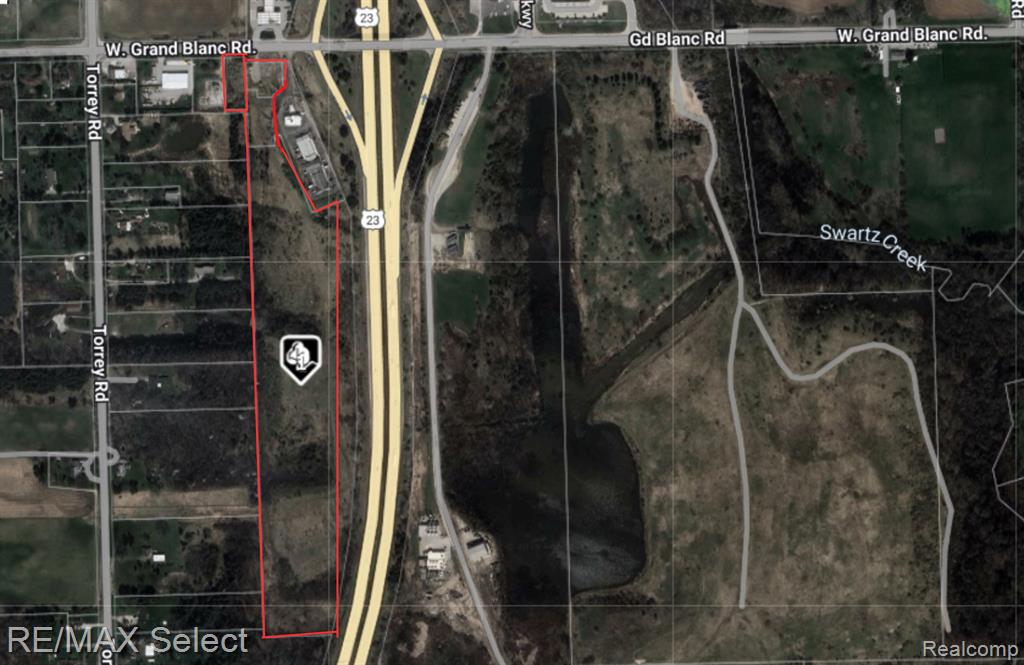 Unlock the potential of this exceptional commercial land opportunity featuring 2,600 feet of frontage along US-23 Expressway and immediate access via the Grand Blanc Road exit. This premier location offers excellent frontage, visibility, a high daily traffic count and is perfect for high-impact development. Includes an additional 18 adjoining commercial acres—ideal for large-scale retail, office complexes, hospitality or mixed-use ventures. Strategic location with strong growth, making it a true “live the dream” investment opportunity. Parcel # 15-23-100-014 (18.84 acres) is included.
