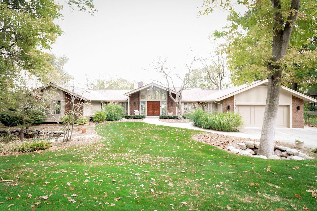 Welcome to your dream retreat on Deer Lake!  This stunning home offers beautifully designed living space, nestled on a sprawling lakeside lot with a lush, manicured yard - perfect for relaxing, entertaining, and enjoying nature year-round.  Step inside and be greeted by views of the water, high ceilings, and a layout designed with both comfort and sophistication in mind.  The gourmet kitchen is a chef's dream, featuring high-end appliances, updated cabinetry, island, stone countertops.  The spacious primary suite boasts lake views with a spacious closet and primary bathroom.  The walkout basement is an entertainer's paradise with room for relaxing, games, and a wet bar.  Located in a peaceful, sought-after neighborhood with easy access to I-75 and downtown Clarkston, this property offers the perfect blend of privacy, elegance, and lake life.