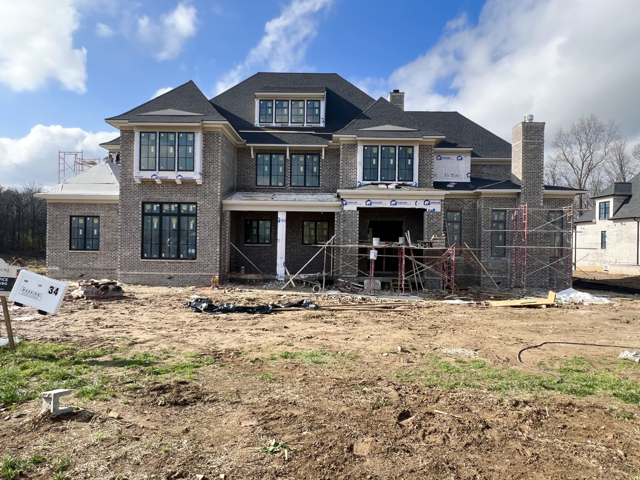 Introducing Your Dream Home: A Stunning New Construction Built by Ford Classic Homes! Nestled in a serene setting, this exquisite 7,505 sq. ft. residence boasts a **private backyard** that backs up to majestic, mature trees, providing an enchanting escape right at your doorstep. Open Concept Floor Plan:Flow seamlessly from the dining room with its elegant wet bar to the expansive great room highlighted by a cozy wood-burning fireplace.Gourmet Kitchen: Experience culinary excellence in a beautifully designed kitchen featuring a spacious **prep pantry**—perfect for the home chef.Outdoor Oasis: Enjoy al fresco dining on the covered porch accessible from both the great room and dining room, featuring another charming wood-burning fireplace and a fully equipped outdoor kitchen.  The primary bedroom, located on the main level, offers a tranquil retreat, complemented by a guest bedroom for visitors. Elegant Study: Work or relax in a sophisticated study adorned with glass iron doors, a coffered ceiling with beams, and yet another wood-burning fireplacefor warm ambiance. Second Level Bonus Room:  Unwind in the huge bonus room featuring a convenient wet bar, perfect for entertaining. Three large secondary en-suite bedrooms provide comfort and privacy for family and guests alike. Your Luxury Lifestyle Awaits!  Don’t miss the chance to make this breathtaking home yours. For more information or to schedule a private tour, contact us today!