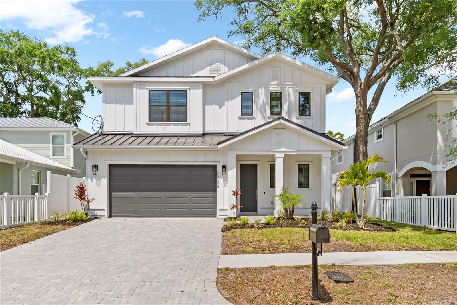 Welcome to 2905 W San Carlos Street. Located in one of South Tampa’s most desirable neighborhoods of Palma Ceia! Situated on a charming brick street that does not flood in Flood Zone X this beautifully designed home offers a highly functional floor plan, elevated finishes, and exceptional walkability right outside your door step. With 10 ft ceilings, 8ft doors throughout abundant natural light, and upgraded flooring throughout, the home feels bright, open, and inviting from the moment you step inside.  The first floor features an open-concept layout ideal for everyday living and entertaining. The gourmet kitchen is equipped with waterfall quartz countertops, premium Bosch appliances, and ample storage. A first-floor bedroom provides flexibility for guests or a private office.  Upstairs, you’ll find four spacious bedrooms, including a luxurious primary suite, along with three full bathrooms, a versatile loft/flex space, and a large laundry room with plenty of storage. Enjoy an open, private, tranquil backyard with city-approved permits for an outdoor enclosure, plus ample space to create a stunning pool oasis—complete with all necessary prewiring already in place.  A 2-car garage offers secure parking and additional storage.  Features about the home include, water softener and 2-stage filtration system, his & her's custom closets, pre-wired for a pool, whole-house surge protection system, smart irrigation system, MOEN Flo smart water monitor & automatic shutoff, and Ring Pro Camera system.  True new construction without the wait. Never lived in—meticulously maintained and thoughtfully upgraded since construction. Amazing value, non flood zone, great square footage and prime location walk to Palma Ceia Park, Hyde Park Village, Bayshore Boulevard, the restaurants along Howard Avenue, and charming local boutiques. Enjoy the perfect blend of modern comfort and South Tampa lifestyle. One or more photos virtually staged.