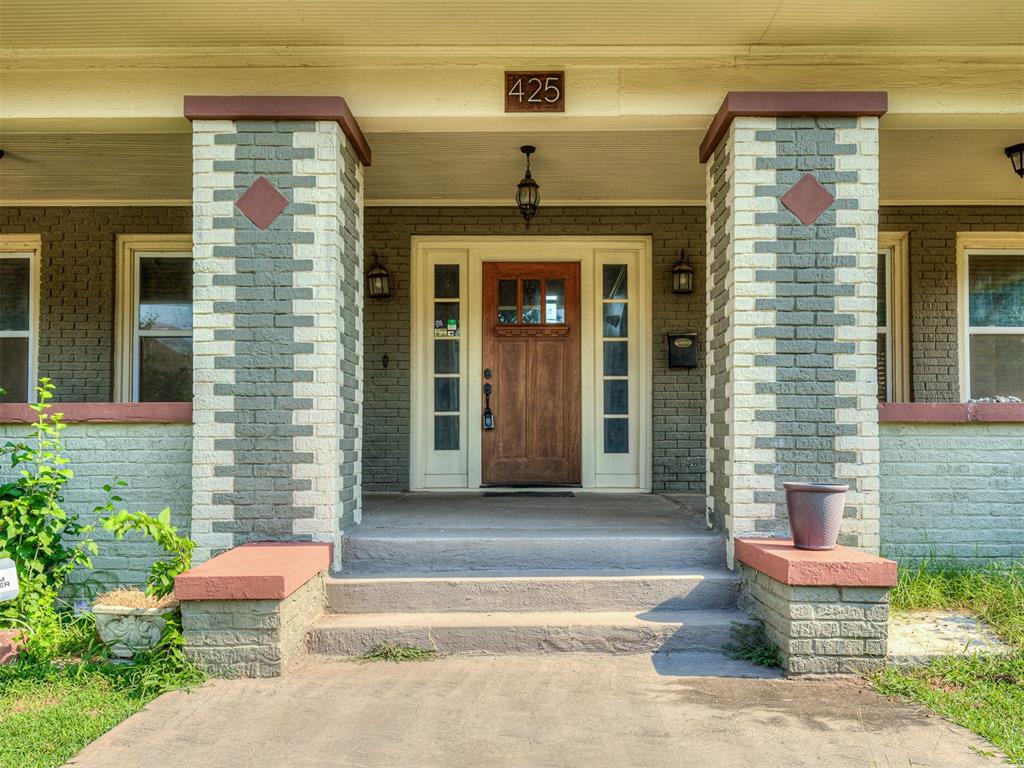What an opportunity to own a beautiful piece of Oklahoma City’s History. 425 NE 15th provides far more than just internal and external beauty. This home boasts the quality and character of the 1920s combined with the modern care and updates that accentuate and the gorgeous original construction. Inside you’ll find finely refinished wood flooring and a the dichotomy of a moody affection with a brightness designed with gorgeous neutrals throughout and inviting natural light to create an inviting environment that feels like home. The wood floors span the areas of the living and dining areas and are perfectly paired with tile in the kitchen, utility room and half bath. YOU READ THAT RIGHT! Laundry room has a designated room on the main floor AND a convenient half bath tucked around the corner from the kitchen. You’ll also feel at ease with a large basement space for our Oklahoma weather and additional storage. On the main level, entertaining can be ideal with the living and dining areas open to one another to encourage gathering. When you visit upstairs you’re greeted with a substantial landing area hosting built ins. The oversized primary bedroom has a gorgeous (non functional) fireplace and French doors opening to windows overlooking the huge back yard. Its updated bathroom features walk in shower and operate claw tub. The additional two bedroom are also very well sized. This property is gorgeous and can’t wait for new owners! Make an appointment with today!