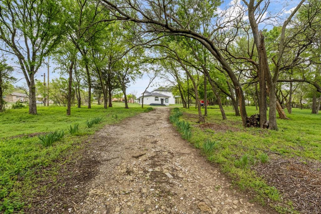Rare 2-Acre Opportunity in the Heart of Downtown Prosper – Zoned Residential SF-15

An unmatched opportunity to own one of the largest and most versatile parcels in Downtown Prosper, TX. Tucked away on a secluded 2-acre, tree-filled lot with rolling topography, this property offers both privacy and proximity—just steps from downtown Prosper’s shops, dining, parks, and charm.

The fully renovated home features:

3 Bedrooms 
3 Full Bathrooms
New luxury flooring
Velvet-finish interior paint
High-efficiency spray foam insulation
Covered patio perfect for entertaining
Private driveway with potential to add a custom entry gate

A 20-ft attached unfinished barn offers exciting possibilities—convert it into a large living space, a luxe primary suite, or add additional two-story guest apartment with its own kitchen, bed and bath for rental.

2 minutes to Gates of Prosper
Under 10 minutes to PGA HQ & future Universal Kids Park