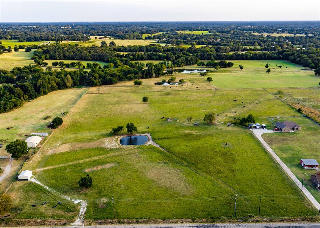 23.6 acres located 2.2 miles south of Wal-Mart in the brand-new Rowena Johnson Elementary boundary. This beautiful property is ready for you to build your dream home. The parcel is approximately 1,500 feet deep, 564 feet of frontage and offers 30 feet of elevation change. Sandy soil that is perfect for adding livestock. Tifton 44, Bahia and Coastal are throughout the property. Perimeter and cross-fencing are in place. Utilities are not installed but are available.