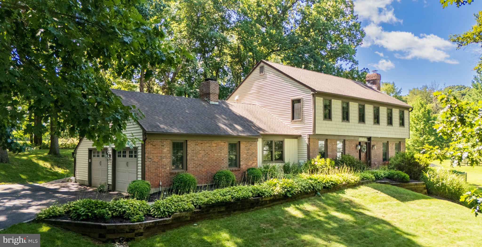 Welcome to 816 Nathan Hale Lane, an immaculate, beautifully upgraded and meticulously maintained five-bedroom, four-and-a-half-bath Colonial set on a gorgeous lot in the coveted Redbridge Farm neighborhood of Pocopson Township, located in the top-rated Unionville-Chadds Ford School District. Truly spectacular both inside and out, this home is ideal for all seasons, offering fantastic year-round living indoors and a private resort-like oasis around the pool during the warmer months. Enter the home via the tiled center entrance hall. To the right is a spacious living room featuring a beautiful wood-burning fireplace with a classic Colonial mantel. To the left is the formal dining room featuring custom moldings, the ideal setting for family meals and holiday celebrations. The heart of the home is the huge eat-in kitchen, featuring a massive granite island that comfortably seats four, vast Corian countertops, upgraded cabinetry, a tile backsplash, a new microwave, two ceiling fans, a separate eating area and a doorway to the fieldstone patio. Just off the kitchen is a terrific family room with a volume ceiling, exposed beams, and an entire wall of brick highlighted by a wood-burning fireplace. A 15-panel glass door, flanked by matching 15-panel glass panels, opens to the wonderful sunroom/screened porch featuring a handsome pine ceiling, skylight, and ceiling fan—a terrific space for relaxing and enjoying the beautiful surroundings. A perfectly positioned powder room rounds out this level, while a convenient mudroom/laundry room leads from the family room to the spacious two-car garage. Tucked away in a quiet rear corner of the home is a private office, nicley situated for working from home or equally well suited as a den or quiet retreat. The second level is home to the sumptuous owner's suite, offering tremendous closet space and a spectacularly renovated owner's bathroom. This gorgeous space features tile flooring, two granite-topped vanities with raised vessel sinks and upgraded faucets, and a beautifully tiled oversized shower with two built-in benches, a rainfall showerhead, and a frameless glass surround. Three additional bedrooms on this level offer generous closet space and are serviced by a nicely tiled hall bathroom with a double vanity. The bonus third level offers a spacious fifth bedroom with a skylight, excellent closet space, and its own en suite bathroom, creating a wonderful private retreat for family or guests. The beautifully finished lower level provides even more terrific living and entertaining space. A tiled kitchenette area serves as the perfect transition between the interior of the home and the pool. This area features a sink, cabinetry, counter space, mini refrigerator, built-in benches with storage underneath, and a door leading directly to the pool. A full bathroom on this level is thoughtfully designed for pool use, with the toilet and shower located in separate rooms. A spacious unfinished area provides plenty of storage. A fieldstone patio off the kitchen is ideal for grilling, entertaining, relaxing, and dining al fresco, while the beautifully situated pool creates a private oasis throughout the warmer months. Its thoughtful placement also keeps it largely out of the home's primary sight lines during the winter. Hardwood floors, ceiling fans in all bedrooms and throughout the home, recessed lighting and much more all come together to create a beautiful place to call home. A rare opportunity to own an immaculate, move-in-condition home in a prime location. Welcome home!