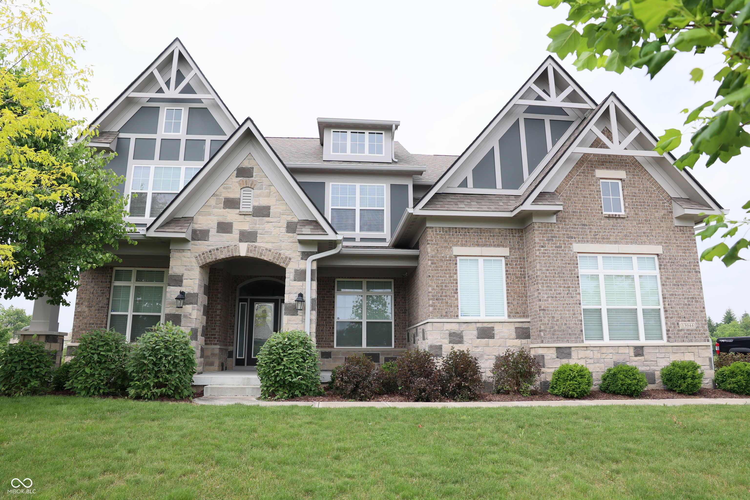 Nestled in the desirable city of CARMEL, IN, the single-family residence at 13044 Moorland LN presents an attractive property in great condition. This home offers a blend of comfort and sophistication, promising a lifestyle of relaxed elegance.  The heart of this residence is undoubtedly the kitchen, a culinary haven designed with both aesthetics and functionality in mind. Shaker cabinets provide ample storage, while the backsplash adds a touch of refinement. A double oven stands ready to handle feasts, and the large kitchen island offers a central gathering point. The wall chimney range hood and high-end range oven cater to the discerning chef, while the stovetop and kitchen peninsula enhance the cooking experience. Crown molding adds a final flourish, and the kitchen bar provides the perfect spot for casual dining or entertaining.  The living room is designed to inspire relaxation and connection. A fireplace serves as a warm and inviting focal point, complemented by the soaring high ceiling that enhances the sense of space. Built-in shelves offer both storage and display opportunities, adding a touch of personalized style.  The bathroom provides a spa-like experience, featuring a tiled walk-in shower that offers a refreshing escape.  This residence boasts five bedrooms, offering abundant space for rest and rejuvenation. The bedrooms are enhanced with crown molding, adding architectural interest and a sense of refined elegance.  Beyond the interior, the property extends its allure to the outdoors. A porch provides a welcoming entry and space for relaxation, while the patio offers an ideal setting for outdoor dining and entertainment. The water view enhances the sense of tranquility, while the residential area ensures peace and privacy.  Additional features include an open floor plan that creates a sense of spaciousness and connectivity, and a walk-in closet that provides generous storage.  This CARMEL residence presents an exceptional opportunity to embrace a lifes