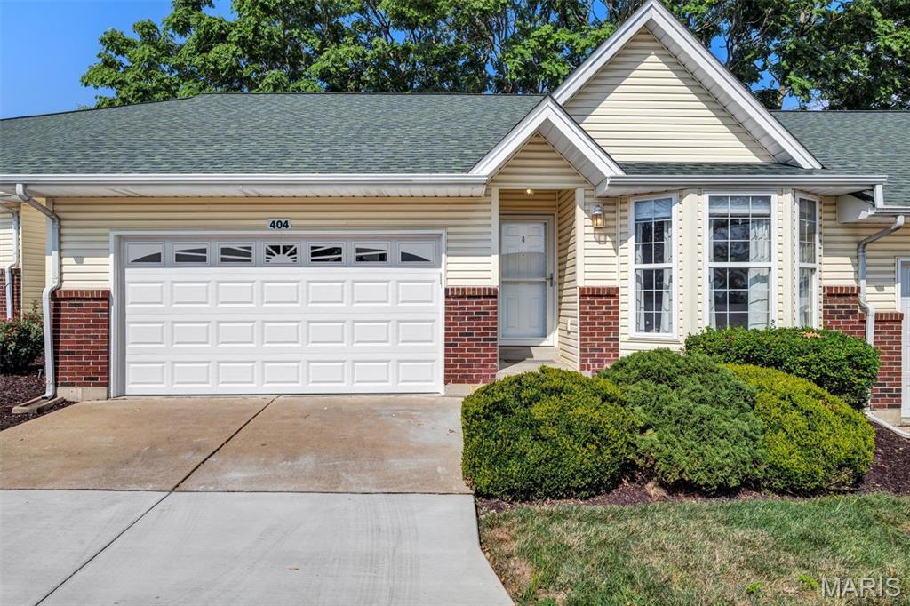 Villa life is calling! Located in the desirable Cardinal Commons subdivision, this inviting 2-bedroom, 2-bathroom attached villa offers comfortable, thoughtfully designed living space—all on one convenient level.  Vaulted ceilings and abundant natural light give the open living, dining and kitchen areas a bright, spacious feel. The kitchen offers generous cabinetry, ample counter space, stainless-steel appliances and a breakfast bar that keeps the cook connected to the conversation. A charming bay window brings even more natural light into the dining area.The primary suite features a private bathroom and its own bay window, while the second bedroom is ready to flex as a guest room, home office or hobby space. Main-floor laundry means no hauling baskets up and down stairs, and the attached two-car garage provides plenty of room for parking and storage.Need room to grow? The expansive unfinished basement is a blank canvas with excellent storage, future finishing potential and a rough-in for a third bathroom. Conveniently located near St. Peters shopping, dining, parks and major roadways, this Cardinal Commons villa proves that good things really do come in perfectly sized packages!
