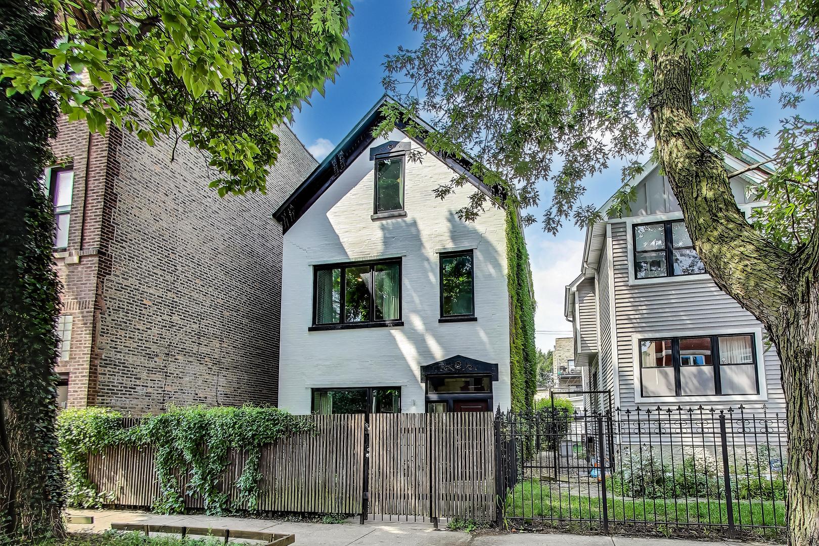 Beautiful complete rehab of charming 3 story home with tons of character by well know architect on beautiful side street in the heart of the Augusta/California corridor. This custom home features incredible design elements including a kitchen with modern white cabinets to the ceiling, full wall backsplash, solid wood counters, built-in stainless stove top and oven, Bosch dishwasher, recessed lighting and large farmhouse sink.  Extra high 11 ft ceilings create huge open space in the living and dining rooms which are capped by huge custom windows for extra light and includes floor to ceilings bookshelves, built-in desk and cabinets, specialized lighting, and real hardwood floors throughout the entire property. The 2nd floor contains 3 nice-sized bedrooms including a large primary that easily fits a king-size bed with a walk-in closet with organizers, washer/dryer, custom bathroom with double bowl vanity & separate toilet closet. Extremely cool top floor easily makes a 4th bedroom or additional family room or office and boasts exposed beams and brick, a vaulted ceiling and hardwood floors.  This incredible home also features a 2-story entry foyer and an amazing mudroom with an entire wall of built-in cabinets. The huge professionally landscaped yard is a gorgeous oasis with a custom pergola, flagstone patio and is surrounded by beautiful flowering plants.  The new large garage offers easy parking for 2 cars and tons of storage. Easily to add 1 or 2 additional bathrooms and or create 1 or 2 extra bedrooms on 3rd floor.