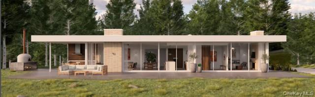 A rare, design-forward opportunity to build a modern, mid-century inspired residence in a thoughtfully planned enclave of similar new construction homes. Set on a beautiful one-acre lot along a private gated road in peaceful South Salem, this single-level design emphasizes clean lines, natural light, and seamless indoor-outdoor living.  Walls of glass and an open layout bring the surrounding landscape into the home, creating a bright, tranquil living experience. Buyers have the unique ability to work directly with the builder to customize finishes and tailor the design to their personal vision.  The proposed residence offers approximately 3,000 square feet with four bedrooms and three and a half baths. Geothermal heating provides energy-efficient comfort and sustainability.  Located within the Katonah-Lewisboro school district, this offering blends privacy, thoughtful design, and a serene setting with convenient access to shopping, dining, schools, and outdoor recreation.