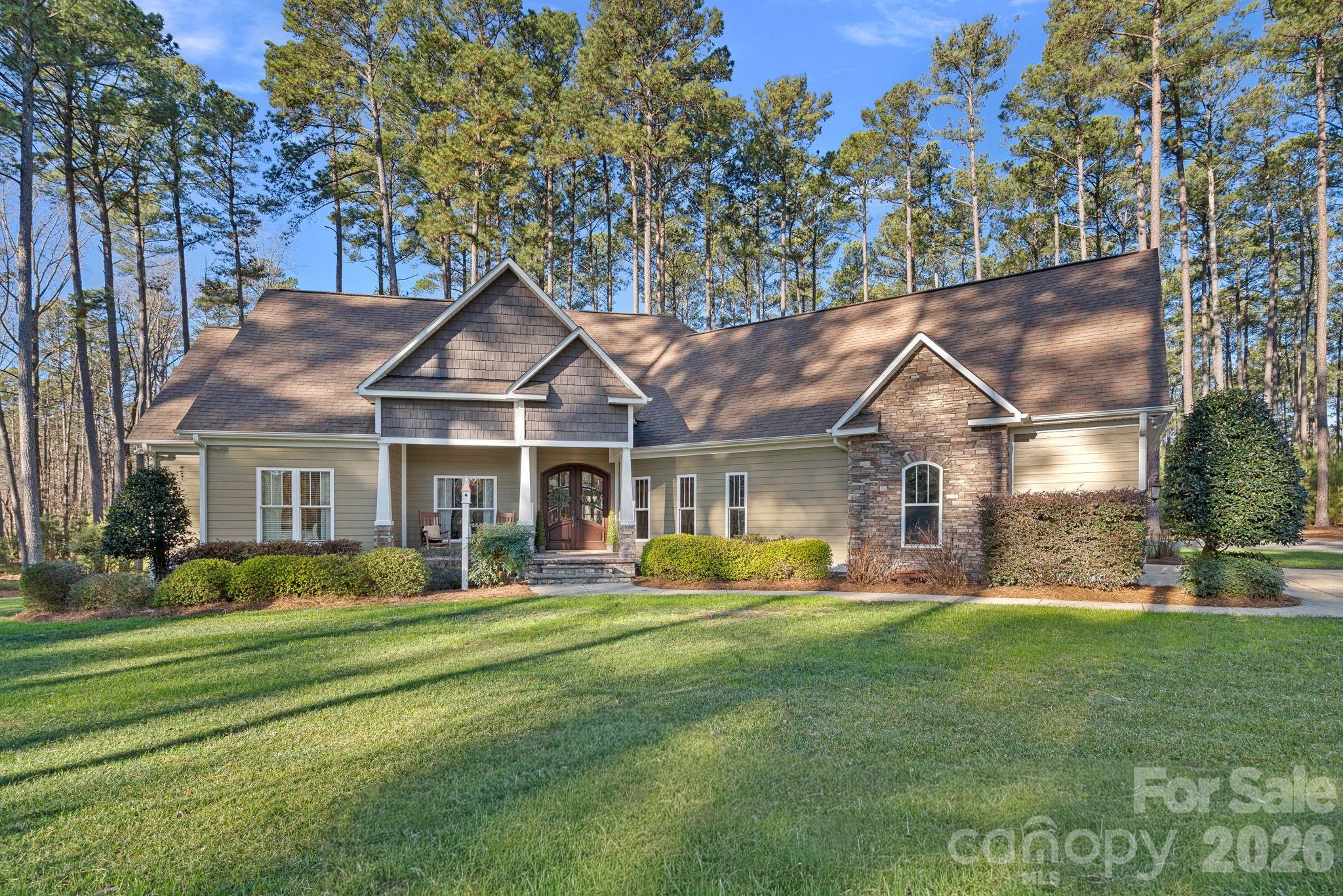 There are homes that simply check boxes… and then there are homes that make you exhale the second you pull into the driveway.This one is special.Tucked away in a peaceful setting in Locust and nestled on 8 beautiful acres filled with mature pine trees, this home offers the kind of lifestyle so many people are craving right now—space, privacy, and comfort, without feeling far from everything. The long, quiet approach through the trees sets the tone from the very beginning.From the moment you step inside, you’ll feel the warmth: natural light, an inviting layout, and finishes that make everyday living feel just a little more elevated.The living room is anchored by a cozy fireplace—perfect for quiet nights in—while the kitchen and dining areas are designed for connection… the kind of place where memories are made, laughter is loud, and people naturally gather.The primary suite on the main level feels like a retreat—private, calming, and thoughtfully laid out. Additional bedrooms offer flexibility for family, guests, or even a workout space, and the dedicated home office makes working from home feel peaceful and productive.Upstairs, the bonus room with an additional bath is a true gift—ideal for a media room, playroom, or guest suite—giving this home the versatility today’s buyers want.And outside… the quiet. The towering pines, the open space, the fresh air. With 8 acres to call your own, this property invites you to slow down and truly enjoy life—coffee on the porch, sunset skies through the trees, and the feeling of being home.If you’ve been waiting for a home that gives you both comfort and lifestyle—this is it.