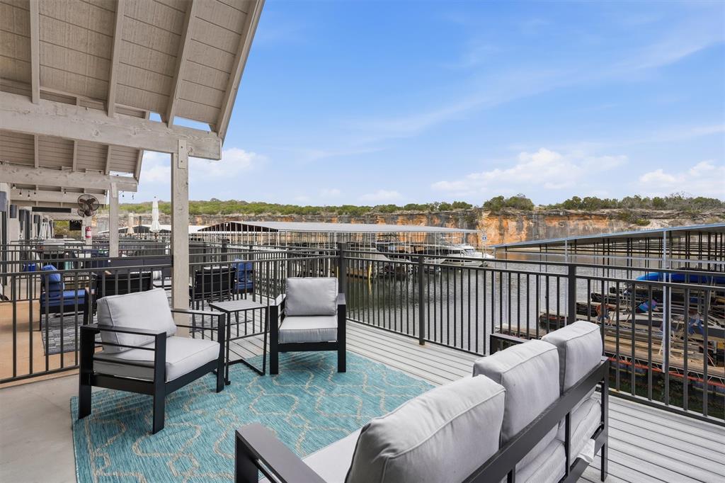 Ultimate lakefront retreat—don’t let the size fool you! This thoughtfully designed property offers everything needed for the perfect weekend getaway. Featuring 2 bedrooms, 3 bathrooms, and a dedicated laundry area, the home was completely rebuilt from the ground up in 2025. Being sold fully furnished for true turn-key convenience. Enjoy two patios with beautiful lake views, perfect for relaxing or entertaining. Located just steps from the water with direct access to Bluff Creek Marina and access to a resort-style community pool. The perfect lock-and-leave lake escape.