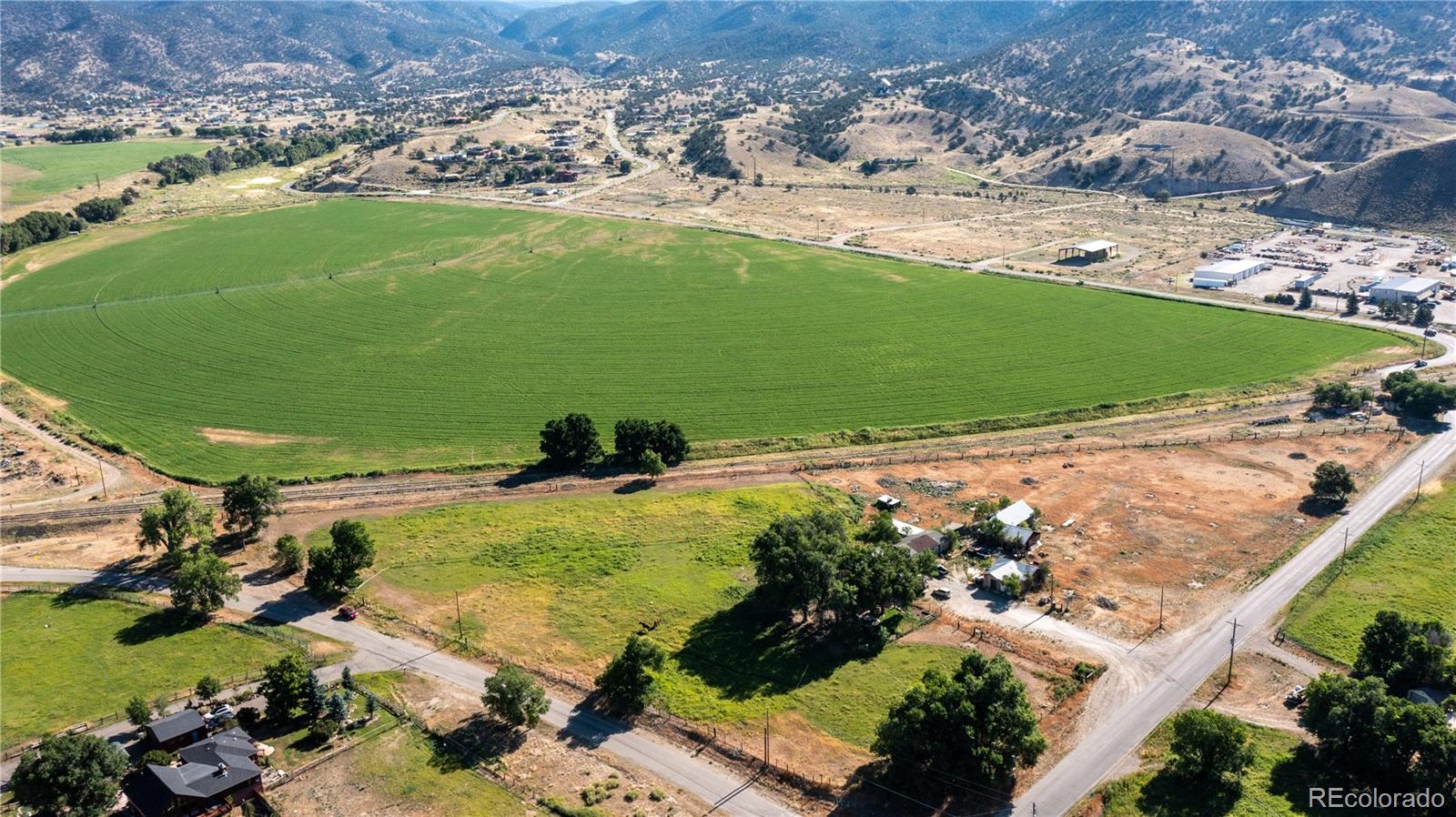 Rare opportunity to purchase 120+ acres of land bordering Salida, Colorado! This unique property has it all ... 800' of Arkansas River frontage, main home with soaring windows and incredible views perched on 40 acres above the valley floor, rental/income home, 70 acres of prime irrigated farm land, hay shed on 2 acres, all within biking distance of town! This once in a lifetime opportunity could provide you with an incredible home, alfalfa fields, and rental income, or become the next large scale development on the edge of Salida. Currently equipped with an extensive irrigation system (pivots, side roll, pump station) along with 432 shares of the Williams and Hamm Ditch Company, and tailwaters of the Highland Seepage Ditch. Each home has a domestic well, with a 3rd permitted well at 8720 CR 175, and augmentation pre-purchased for a future well on the 2 acre hay shed (mixed use rural) site. Check out the drone video at book.emeraldrealestatemedia.com/6600-County-Road-176 for a closer look!