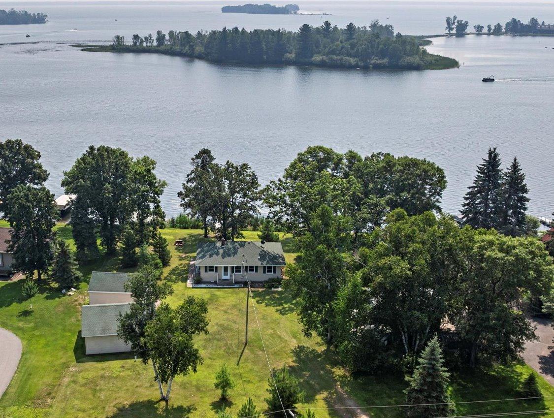 Experience Pelican Lake life at this furnished 2-bedroom, 1-bathroom year-round cabin on Breezy Point Bay. With 100 feet of gradual to level elevation directly leading to the water, this cabin offers breathtaking easterly sunrise views and includes a boat, ensuring you're ready for adventure from day one! This meticulously maintained home features an open floor plan for seamless one-level living and stunning lake views. You'll also benefit from two spacious detached garages—one measuring 23 x 16 and the other 24 x 24—perfect for all your storage needs. Hop in the golf cart and enjoy the short ride to top-notch restaurants in Breezy Point or challenge yourself at one of the premier local golf courses. Gather around the lakeside fire pit with friends and family under the stars, roasting marshmallows and creating unforgettable memories. Positioned just minutes from the vibrant amenities in Crosslake, Pequot Lakes, and Nisswa, you'll have access to exceptional dining, diverse retail shops, and elite golf courses. If you're searching for a cabin at the center of the Lakes Area, look no further—this is your ideal destination! Envision your summer days spent boating on the historic Pelican Lake. Make it a reality today!