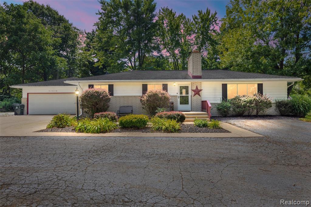 This beautifully maintained brick ranch sits on an exceptional 1.57-acre lot with mature trees and open space. Pride of ownership shows throughout with a spacious floor plan, cozy fireplace, and a finished basement with flex space offering endless possibilities. The peaceful setting includes an extra backyard shed for storage or hobbies, 2 car garage, and just minutes from downtown Lake Orion, parks, schools, and shopping. This move-in-ready home offers comfort, charm, and plenty of space in a convenient location.