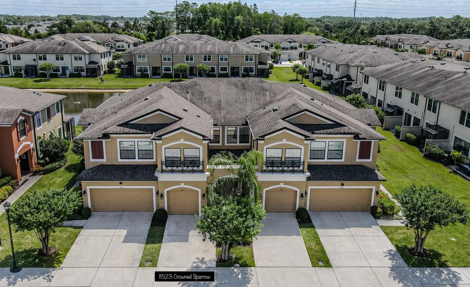 Beautifully upgraded and impeccably maintained, this move-in-ready townhome in a gated Citrus Park community offers stylish living with serene pond views and a thoughtfully designed two-story layout built in 2017. Featuring 2 bedrooms, 2.5 bathrooms, and a versatile loft area, this home offers open, flexible living spaces perfect for today’s lifestyle. Lovingly maintained by its original owner, this impeccably cared-for property shows true pride of ownership throughout. Step inside from the covered front porch into a welcoming foyer that leads to the open-concept heart of the home. The spacious kitchen features beautiful stacked cabinets, granite countertops, stainless steel appliances, a large island, and space for an eat-in table. A custom backsplash extends from the kitchen onto the face of the breakfast bar, creating a cohesive look while adding a practical, protective designer finish. All appliances, including the washer and dryer, convey with the home for move-in-ready ease. From the kitchen, enjoy serene pond views through sliding glass doors that lead to the porch. The dining area is spacious enough for large gatherings and flows seamlessly into the family room, creating the perfect space for entertaining and everyday living. Ceiling fans are thoughtfully placed throughout the home for added comfort. Downstairs, you’ll love the tile flooring that looks like wood throughout, adding warmth and durability, along with custom crown molding that elevates the entire living area. An open wood staircase creates a striking architectural feature, while the first-floor half bath features a custom penny tile accent wall for a stylish designer touch. Out back, enjoy a private patio overlooking the pond—perfect for morning coffee or relaxing evenings while taking in the peaceful water views. Upstairs, you’ll find two spacious bedrooms, including a luxurious owner’s suite with a private bath and walk-in closet. The second bedroom is complemented by a full bath, and a convenient upstairs laundry area makes daily living effortless. A generous loft provides the flexibility for a home office, media room, or additional living space. The garage is equipped with motorized overhead storage racks, offering a smart and convenient solution for maximizing space. Located in highly desirable Citrus Park, this home offers easy access to everything Tampa has to offer. Just minutes to Citrus Park Town Center, top-rated shopping, dining, and entertainment. Quick access to the Veterans Expressway makes commuting a breeze, with Downtown Tampa approximately 20 minutes away and Tampa International Airport approximately 15 minutes away. Gulf Coast beaches are approximately 25–35 miles away, offering easy day trips to some of Florida’s most beautiful shorelines. Ideally situated just minutes from the Upper Tampa Bay Trail, premier healthcare facilities, and the sought-after shopping and dining destinations of Westchase. Enjoy the perfect balance of convenience, lifestyle, and low-maintenance living in a prime location.