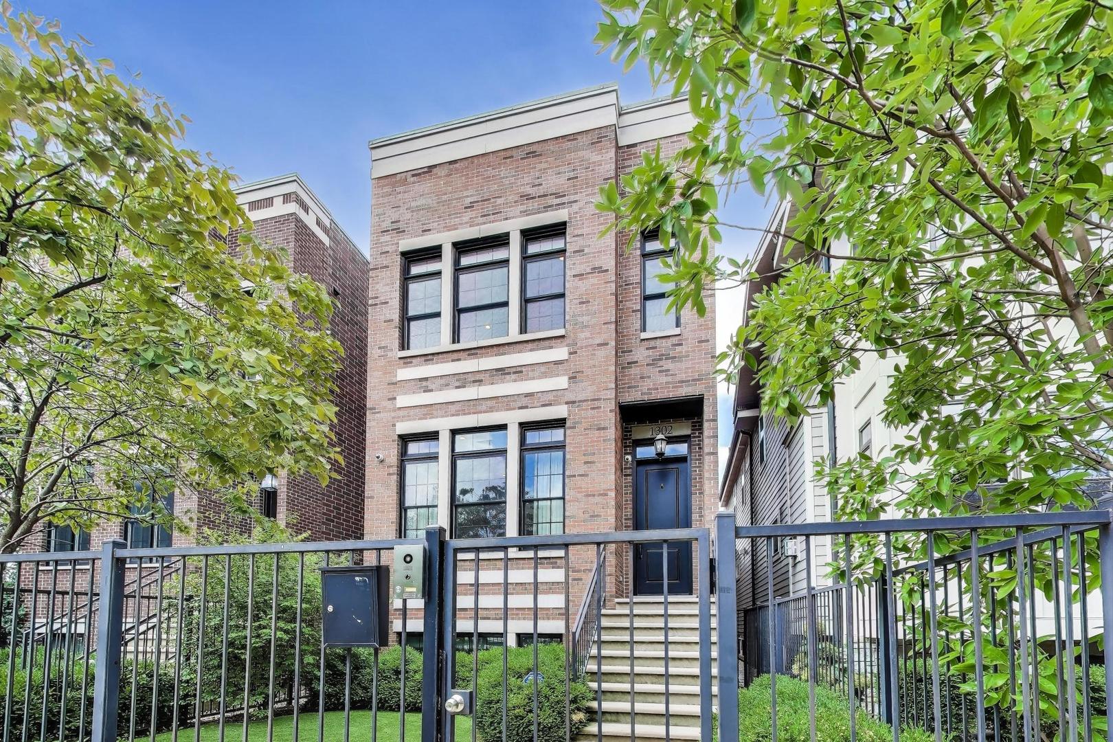 This is your chance to own one of Wicker Park's finest estates! Perfectly situated within walking distance to parks, schools, shopping, dining, transportation, and more-this oversized 5-bedroom, 4.5-bathroom residence offers the best of city living for today's modern family. Designed to impress, the home boasts two indoor fireplaces and one outdoor fireplace, a built-in Sonos surround sound system, security cameras, and custom window treatments-features that make it live even better than new construction. The chef's kitchen is outfitted with top-grade appliances, quartz countertops, and timeless finishes, while hardwood flooring and detailed millwork flows seamlessly throughout. Host unforgettable gatherings with multiple entertaining spaces, including a garage-top patio and a rooftop deck with sweeping views of Downtown Chicago. A rare 2-car garage adds convenience to this luxurious city retreat. Built by one of Chicago's premier luxury homebuilders, this estate combines meticulous craftsmanship with thoughtful upgrades that make it truly move-in ready. If you've been searching for the perfect balance of sophistication, comfort, and location-you've found your home.