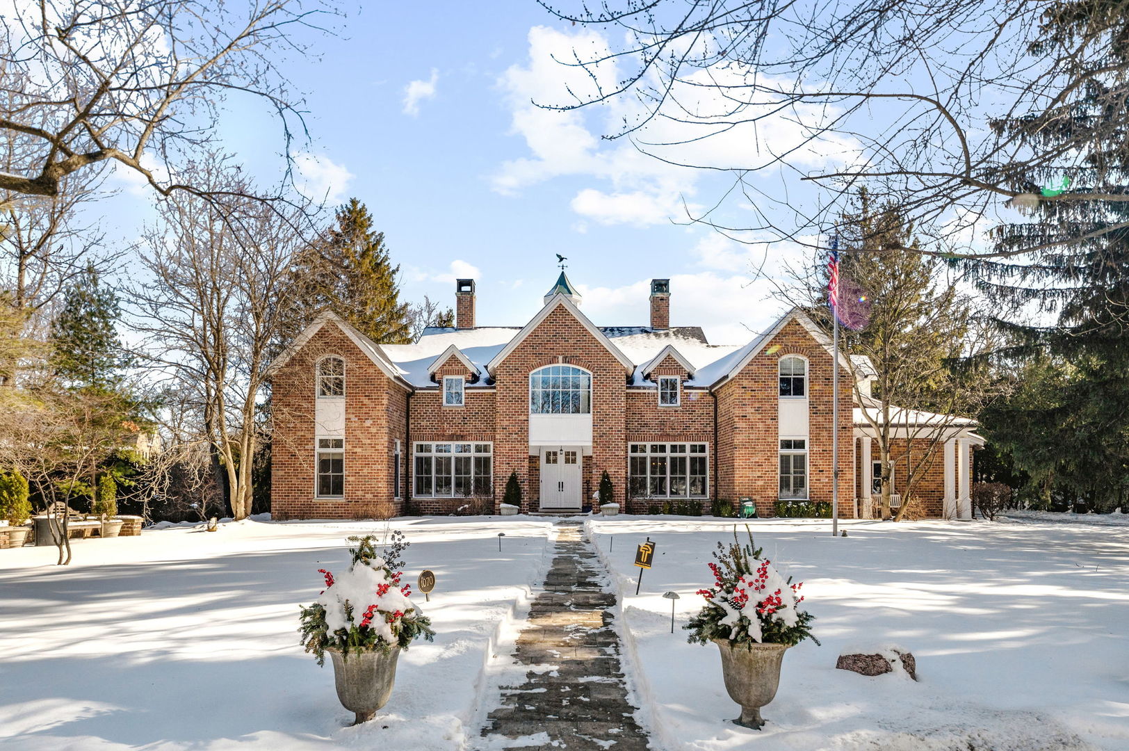 Winnetka living at its finest! This timeless Paul Konstant custom-designed home is set on a rare, sought-after approximate 3/4 acre property on a private lane in East Winnetka and offers over 7900 square feet of transitional living space. Walking into the elegant foyer, the main level features a gracious living room with fireplace and attached sitting room with built-ins, formal dining room, and a transitional chef's kitchen with sun-filled breakfast area overlooking the expansive backyard. The family room with fireplace and office/sunroom (possible first floor bedroom) provide ideal spaces for everyday living and working from home. The second level presents an outstanding family layout with five generous bedrooms and a conveniently located laundry room. The luxurious primary suite is a true retreat boasting a volume ceiling, wood-burning fireplace, dual walk-in closets, spa-like bath, and a private balcony. The finished lower level provides another level of entertainment for the whole family, featuring a large recreation area with wet bar, exercise room, full bath, and a versatile bonus room (media room). A covered rear porch overlooks the private backyard-perfect for family gatherings, or a future pool. Additional highlights include abundant architectural detail and quality throughout, substantial mudroom with side door, ample storage, and an attached three-car garage. Recent upgrades include new hardwood floors, newly renovated basement, new led lighting and chandeliers, new roof, new furnace, and water heaters. Ideally located within walking distance to Hubbard Woods, Metra train, and Lake Michigan, you do not want to miss this one!