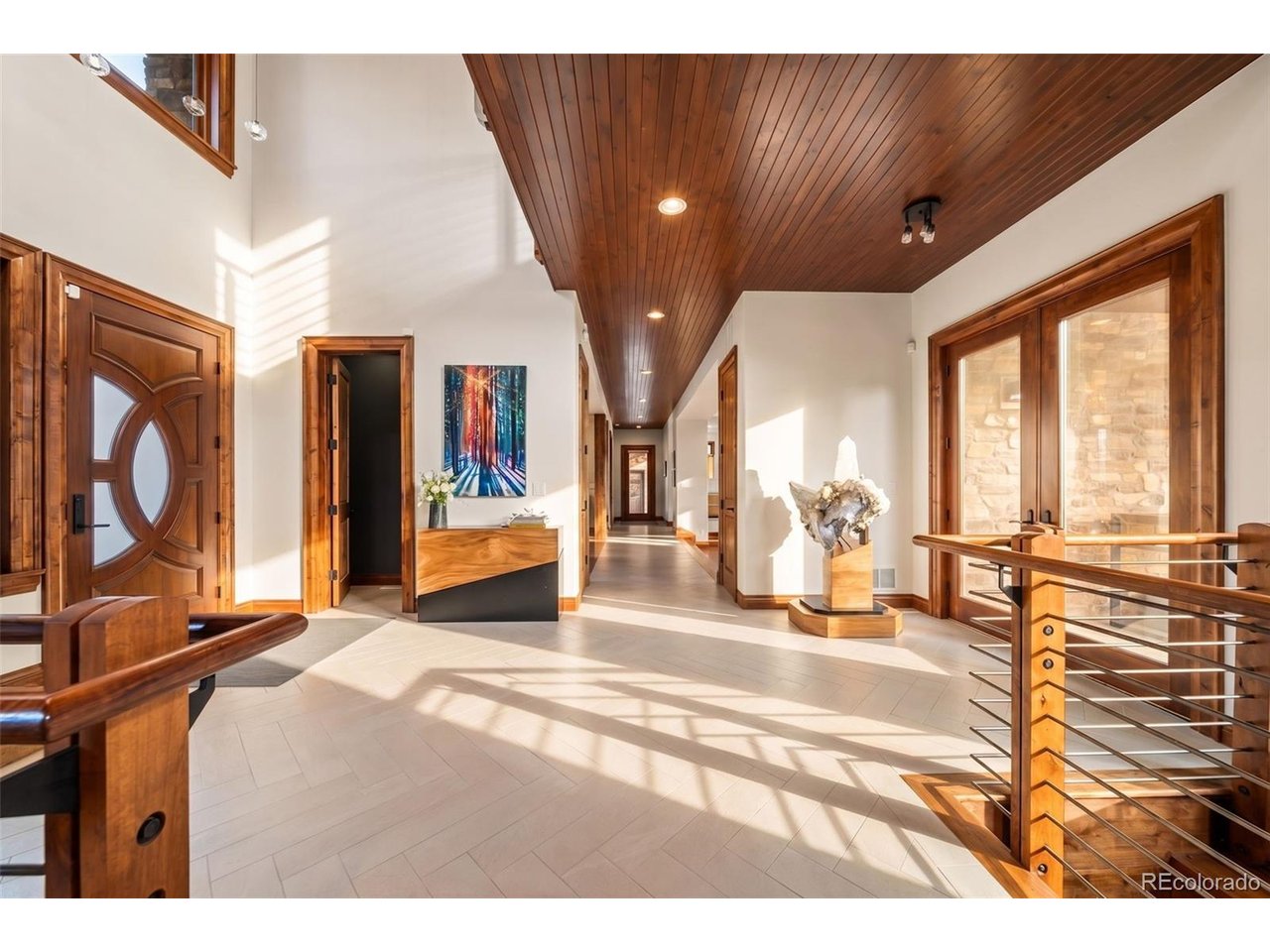 Spanning just over 9,000 square feet in the prestigious Spruce Meadows neighborhood, this nationally award-winning modern estate is a masterclass in design, craftsmanship, and livability. Completely reimagined through an extraordinary renovation, the residence is defined by gallery-quality detailing, where every finish and fixture was intentionally selected, from artisan stonework to Ann Sacks tile, Bespoke fixtures, and Shakuff lighting throughout. The primary suite serves as a private sanctuary, while every bedroom has its own ensuite bathroom and walk-in closet. Equally impressive are two dedicated office spaces: a private study with a spiral staircase leading to a loft library, and a separate executive office with the potential as a guesthouse.Central to the home's transformation is an exceptional open-concept living area, where the dining room was thoughtfully reconfigured to create greater flow, connection, and light. Anchoring the space is a remarkable chef's kitchen appointed with quartz countertops, hand-blown glass lighting and professional-grade appliances featuring double ovens, double dishwashers, an oversized refrigerator, and a walk-in pantry, creating a space that performs as beautifully as it presents.Designed for unforgettable entertaining, the lower level offers a glass-enclosed wine room, bar, media lounge, billiards room, fireplace, gym, and private guest suite with exterior access. Beyond the walls of the home, professionally curated grounds create a private resort, complete with a pool, hot tub, solar-roofed cabanas, koi pond, fire feature, outdoor kitchen, expansive patios and lounges, custom built play structure, raised garden beds, fruit trees, exquisite flowers, and manicured lawns. Every outdoor space was designed for gathering, celebrating, and everyday enjoyment.More than a home, 15133 Prairie Place is a one-of-a-kind modern estate where award-winning design and resort-caliber living come together in extraordinary fashion.