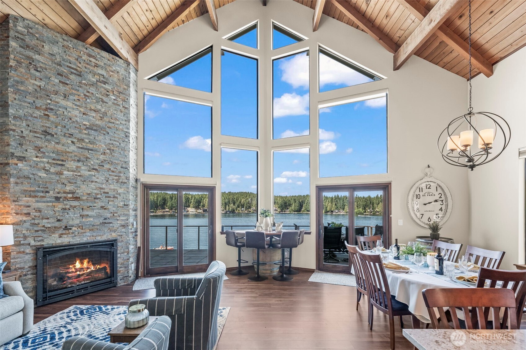 Mason Lake Life is calling!  On the coveted west facing shoreline where sunsets steal the show, your views are perched above the rest.  This stunner, fully reimagined in 2018, blends luxury & livability across three levels, each w/ beds/baths, so everyone has space to unwind.  The soaring 25 ft great room window wall brings the lake to your feet.  The lower level is the ultimate hang out zone w/ movie room & custom wine bar.  But the real magic?  Outside!  Multiple decks & patios lead to your private dock & crystal clear water - spend your days floating, boating, or soaking in sun!  Community club offers pickleball & a myriad of social events.  Just 45 mins from Gig Harbor - offered fully furnished & turn key!  Your BEST life is HERE!