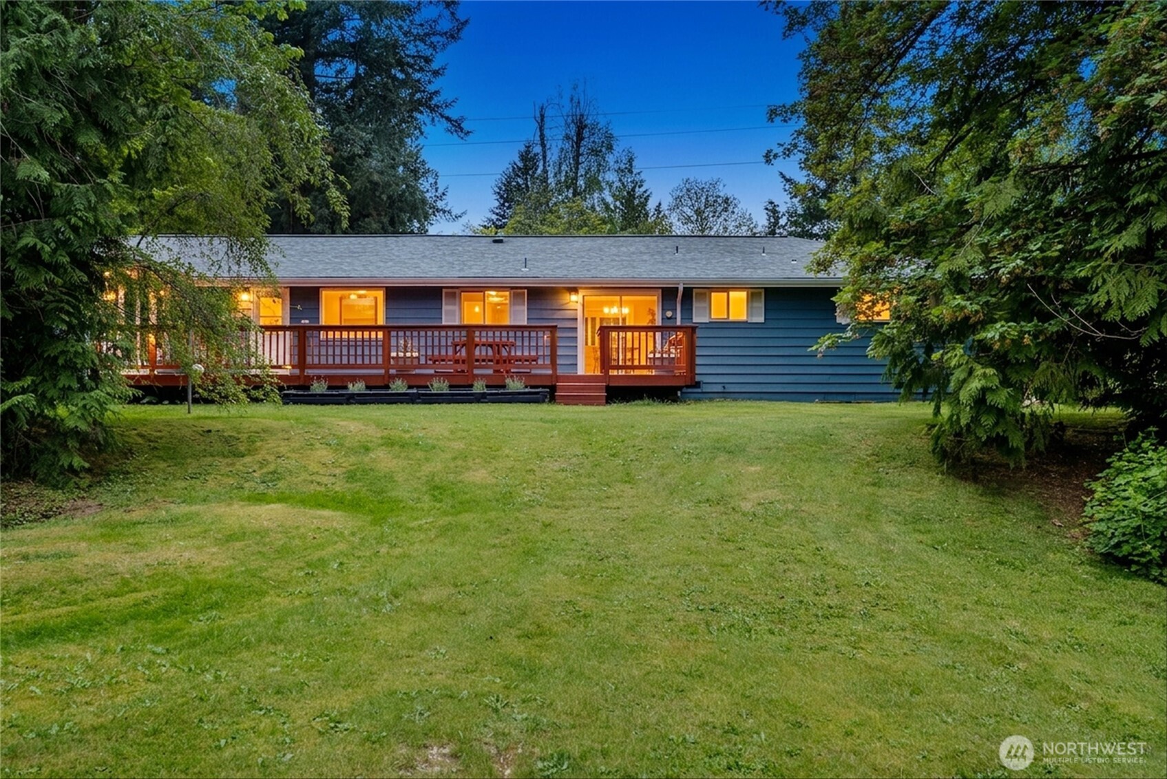 Tucked away on over 2 private acres in Kent, this fully remodeled rambler offers the perfect combination of modern updates, versatility, and peaceful surroundings. Thoughtfully refreshed throughout, the home features stylish finishes, inviting living spaces, and a functional layout designed for both everyday living and entertaining. The main level includes a spacious primary suite along with 3 additional bedrooms and one non-conforming bedroom, while large windows fill the home with abundant natural light, creating a bright and welcoming atmosphere. Enjoy a 790 sq ft finished basement, offering exceptional flexibility with two additional non-conforming rooms, 3/4 bath, and potential for a future ADU setup with kitchen—ideal for multigenerational living, guest space, a home office, workout room, or possible rental opportunity. The expansive 2+ acre property provides room for recreation, gardening, RV parking, hobbies, or future projects, all surrounded by mature greenery for added privacy. A spacious 2-car garage offers ample parking, storage, and workspace. Enjoy the tranquility of acreage living without sacrificing convenience, with easy access to major freeways, shopping, dining, schools, commuter routes, and adjacent access to Lake Young Reservoir trails. A rare move-in ready opportunity offering land, flexibility, and lifestyle.