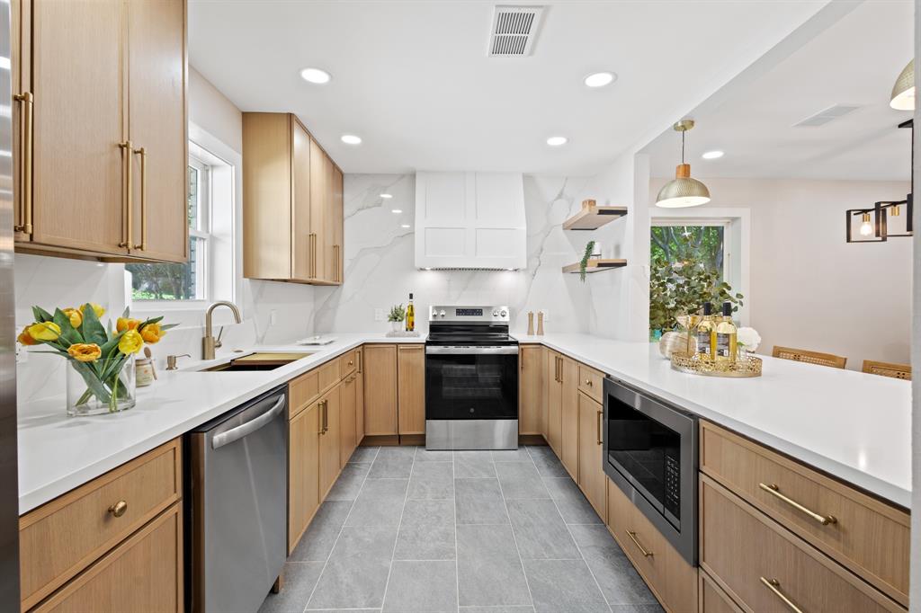 A beautifully updated home in Dallas featuring a resort-style pool and spa, a thoughtfully upgraded designer interior, and a landscaped courtyard that seamlessly connects the flow of the main living spaces. At the center of the home is a designer kitchen with high-end quartz countertops, a quartz backsplash, custom range hood, sleek light oak cabinetry, and stainless steel appliances — offering a perfect blend of style and function. The layout is ideal for both everyday living and entertaining. Step outside to your private courtyard oasis, beautifully landscaped and designed to enhance the indoor-outdoor connection of the home’s common areas. Don't miss the two closets in the primary bedroom. The attached two-car garage adds convenience and practicality. Located on a quiet street with easy access to shopping, dining, parks, and major highways, this turnkey home offers luxury, comfort, and convenience in one incredible package