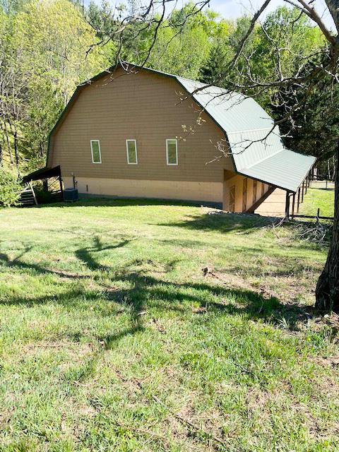 BRING YOUR HORSES and Escape to your own private mountain sanctuary in the heart of Southwest Virginia. Nestled in a secluded valley, this stunning 3-bedroom, 2-bath home offers approximately 3,100 square feet of living space on 35.24 acres of breathtaking countryside. Surrounded by mature timber, rolling pasture, and peaceful mountain views, this property delivers the perfect blend of privacy, functionality, and natural beauty. Step inside to an inviting open-concept living area featuring vaulted ceilings, abundant natural light, and a cozy gas-log fireplace—ideal for relaxing after a day outdoors. The spacious kitchen and dining area flow seamlessly for entertaining, while the primary suite offers a walk-in closet and comfortable retreat space.  Enjoy the sights and sounds of nature from the large screened-in porch, or take in panoramic views from the open deck overlooking your land and the nearby creek.  Built for Country Living & Hobby Farming This property is perfectly suited for a mini-farm, or recreational getaway:  35+ acres with a mix of wooded land and open pasture Creek frontage and scenic trails throughout. Barn with multiple stalls and a tack room, an additional outbuilding, greenhouse, and storage options. Room for horses, livestock, or agricultural use. Unmatched Location for Outdoor Enthusiasts Located just minutes from some of the region's most sought-after destinations: New River access, Grayson Highlands State Park, Jefferson National Forest, Virginia Creeper Trail, Appalachian Trail to name a few. Whether you're looking for a full-time residence, vacation retreat, or income-producing getaway, this property offers unlimited potential.