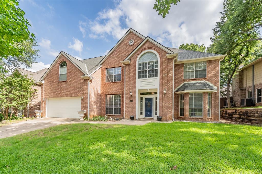 Come see this exquisite North facing home nestled in a well-established neighborhood adorned with mature trees just minutes from DFW Airport.  This spacious five bedroom two story home features two living areas and two dining areas ideal for any size family or for entertaining. The ample kitchen with white cabinets boasts stainless steel appliances, an island and tons of counter space ready for any level chef.  The bay window over the kitchen sink with a plant ledge ideal for your home grown herbs and for watching kids play or nature in the backyard.  Office on first floor with built in shelves and french door perfect for work at home, crafts, at home gym, etc.  The oversize primary bedroom on the 2nd floor has plenty of space for a sitting area & the en-suite bathroom consists of a large walk-in closet, dual vanities, and jacuzzi garden tub for relaxing at the end of the day.  All bedrooms are on the second floor perfect for peaceful separation from entertaining and living spaces.  Picture entertaining or just relaxing under the beautiful shade trees in the backyard.  This beautiful home provides easy access to top-rated Grapevine-Colleyville ISD schools, parks, scenic walking trails, shopping, restaurants, and entertainment, all just west of DFW Airport!