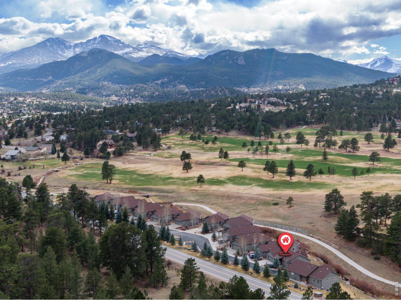Rare opportunity to own a stunning mountain retreat that has been pre-inspected with all items addressed for peace of mind! This home is perfectly positioned along the golf course with gorgeous views and tranquil sounds of Fish Creek nearby! This beautifully appointed home offers scenic tranquility and a true lock-and-leave lifestyle. Set just above Fish Creek and safely out of the flood plain, you'll enjoy the soothing sounds of nature while being steps from the 18-hole golf course and the Fish Creek Trail. Frequent visits from local wildlife create a truly peaceful mountain living experience. Whether you're heading into the mountains or downtown Estes Park for dining and shopping, everything is within easy reach. Inside, the home exudes warm, mountain-inspired character with rich hardwood flooring, soaring vaulted ceilings, and a stunning floor-to-ceiling stone fireplace that anchors the main living space. Expansive picture windows frame the surrounding views and fill the home with natural light. The property features a spacious deck and a lower-level patio-perfect for gatherings or quiet mornings taking in the scenery. The kitchen and bathrooms are finished with solid wood cabinetry and granite countertops. The spacious kitchen features a large pantry and abundant cabinetry, offering exceptional storage and organization. The fully finished walkout basement offers incredible flexibility, featuring two bedrooms, a full bathroom, a second living area, and a dedicated laundry room-ideal for guests or extended stays. The home is equipped with a highly desirable on-demand hot water heater, providing endless hot water and energy efficient performance. Whether you're looking for a full-time residence, second home, or investment opportunity, this property delivers the best of Estes Park living in a truly exceptional setting.