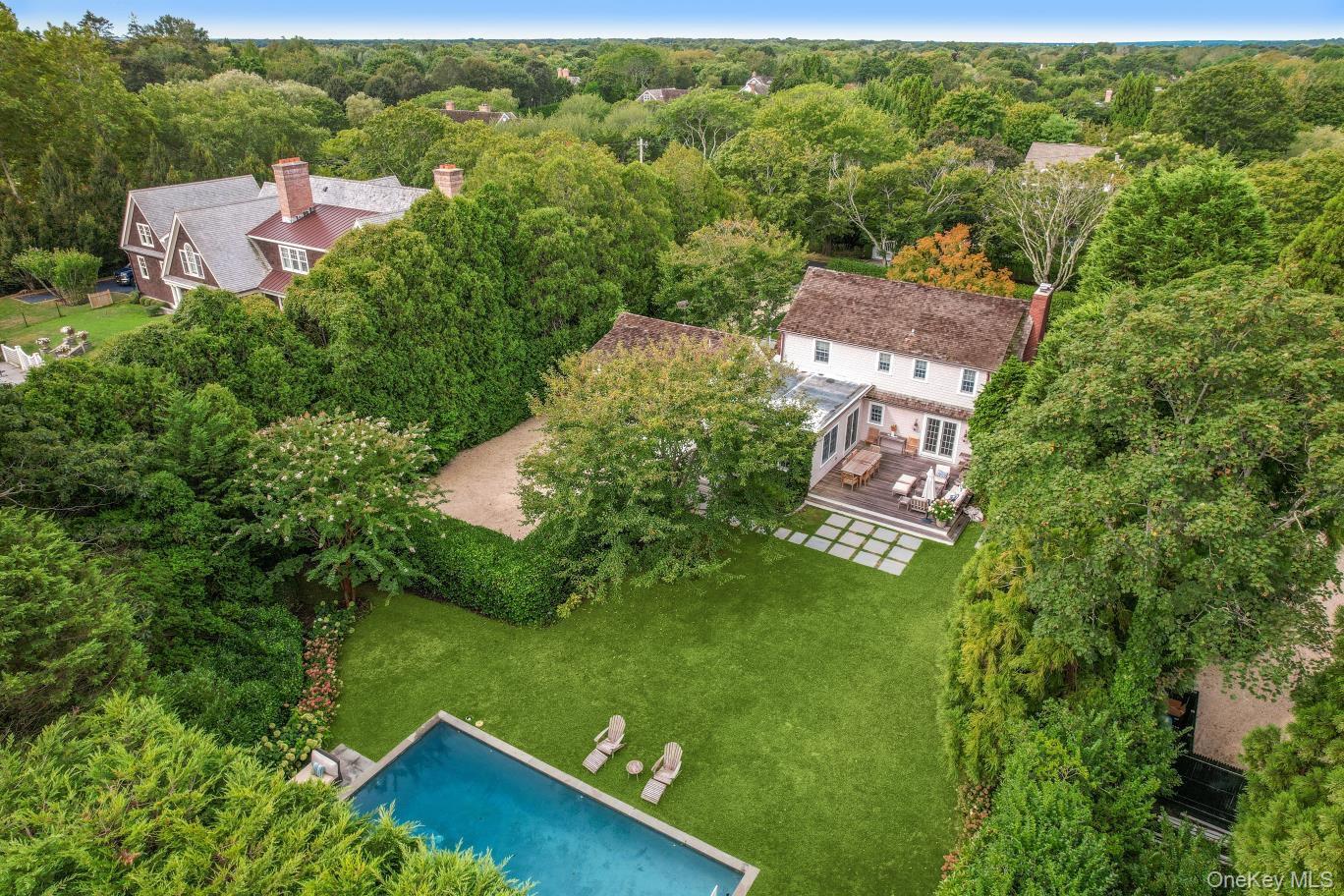 Charming Traditional in Southampton Village's Estate Section
Situated on prestigious Captains Neck Lane, this beautifully renovated shingle-style residence is nestled on over half an acre in the heart of Southampton Village's coveted estate section, minutes from shops, restaurants and world class ocean beaches. Offering a turn key elegant home with modern amenities, the home features 4 bedrooms, a gracious living room with fireplace, a cozy den/library, and an oversized chef's eat-in kitchen that opens to a spacious outdoor mahogany deck-perfect for alfresco dining and entertaining. Freshly decorated and thoughtfully updated throughout, the main level includes generous living and entertaining spaces, while the second floor boasts a luxurious primary suite and two additional bedrooms with a shared bath. A separate staircase leads to a private guest suite-ideal for visitors or an au pair. The partially finished lower level provides a comfortable room, expanding the home's versatile living space. Outdoors, lush landscaping and a wide rolling lawn create a tranquil, resort-like setting complete with a heated Gunite pool, an outdoor shower and a two-car attached garage. The property also offers expansion potential. A rare opportunity to own in one of the most desirable locations in Southampton Village at this price point. Exceptional value, location and timeless style, this is Hamptons living at its finest.