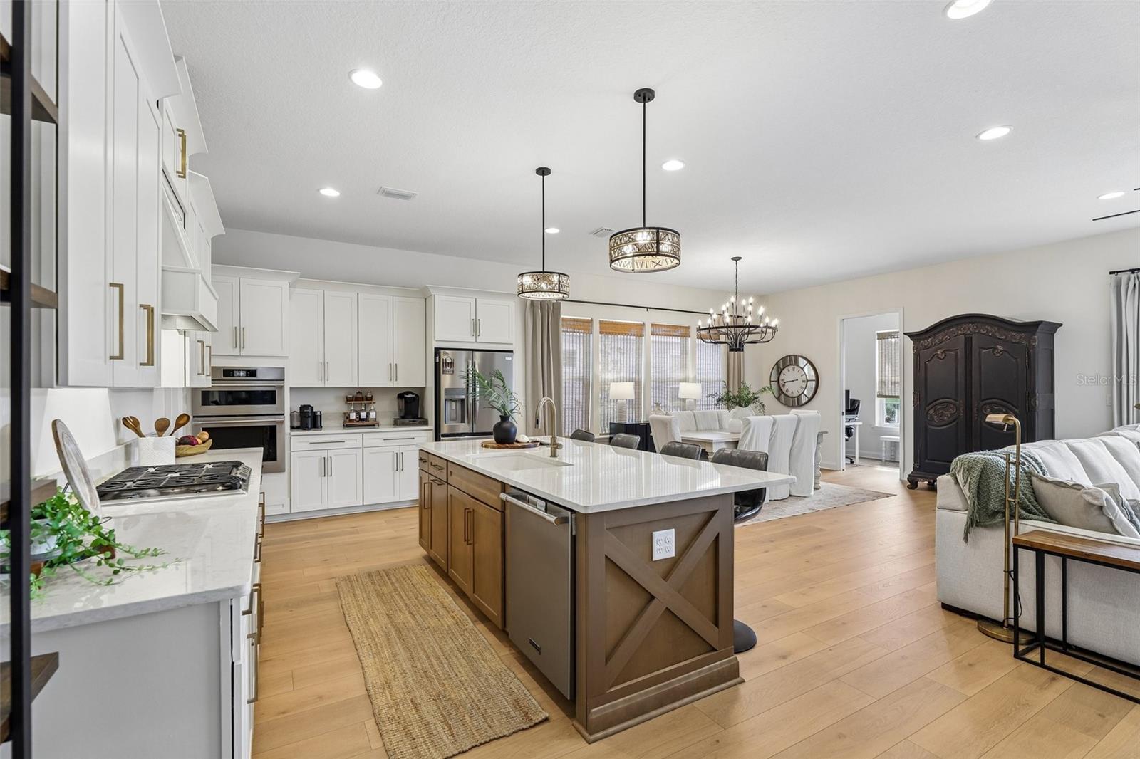 Experience refined Florida living in this beautifully appointed waterfront pool home in SilverLeaf's sought-after Silver Landing neighborhood. Built in 2024 by Riverside Homes, this exceptional 4-bedroom, 3-bath custom residence offers approximately 2,496 square feet of thoughtfully designed living space, panoramic lagoon views, a private pool, and an elevated blend of style, comfort, and modern convenience. From the moment you arrive, the home makes an impressive statement with its paver driveway and walkway, soaring ceilings, elegant 8-foot doors, and expansive floor-to-ceiling windows. The open-concept living spaces are designed for effortless entertaining and everyday living, with abundant natural light and tranquil pool-to-waterfront views creating a beautiful backdrop throughout the main living areas. An elegant electric fireplace adds warmth and ambiance to the inviting living space. At the heart of the home, the gourmet kitchen features premium gas appliances, upgraded lightingand designer finishes, flowing seamlessly into the dining and living spaces. A dedicated pocket office provides a private and functional workspace, while the thoughtfully designed bedroom layout offers exceptional flexibility. The guest bedroom features a private en-suite bath, creating a comfortable and inviting retreat for family and overnight guests. The luxurious primary suite provides a peaceful escape with beautiful waterfront views and a thoughtfully designed custom closet with built-ins, offering both style and practical storage. The spacious owner's bath complements the retreat-like feel of the primary suite. Modern conveniences include smart thermostat access, Ring security compatibility, and a tankless water heater. Every detail has been thoughtfully selected to provide the comfort, efficiency, and sophistication expected from a newer luxury residence. Step outside into the beautifully pavered outdoor living space and experience one of the home's most captivating features: breathtaking sunset views over the lagoon. The private pool and waterfront setting create an ideal backdrop for enjoying morning coffee, entertaining guests, relaxing poolside, or unwinding at the end of the day. This exceptional outdoor space provides a seamless extension of the home's living areas and takes full advantage of the serene waterfront surroundings. Ideally located within SilverLeaf, one of Northeast Florida's premier master-planned communities, this residence offers convenient access to the new Baptist Health medical campus, the new Publix shopping center, golf-cart access, top-rated schools, and an exceptional collection of resort-style amenities. Beautifully maintained surroundings, shopping, dining, recreation, and the best of St. Johns County are all within easy reach.A rare opportunity to experience sophisticated design, modern luxury, private pool living, panoramic waterfront views, and the exceptional lifestyle that makes SilverLeaf so desirable.