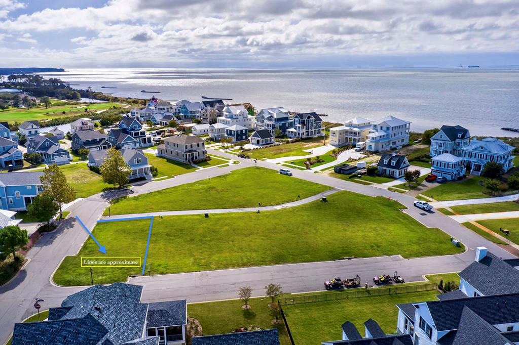 Lot 138 is a prime corner lot just a short distance from the private beach, offering quick access to the Chesapeake Bay. This coveted location also places you moments from the Bay Creek Life Center, featuring state-of-the-art fitness, outdoor pools, and wellness programming. As a Bay Creek property owner, you'll enjoy exclusive membership access to world-class amenities including two Signature golf courses, private beaches, miles of nature trails, new pickleball courts and more Thriving marinas and nearby boutique shopping and dining in the town of Cape Charles! With no required timeframe to build, you can take your time designing the coastal home of your dreams while securing your place in one of the most desirable communities.