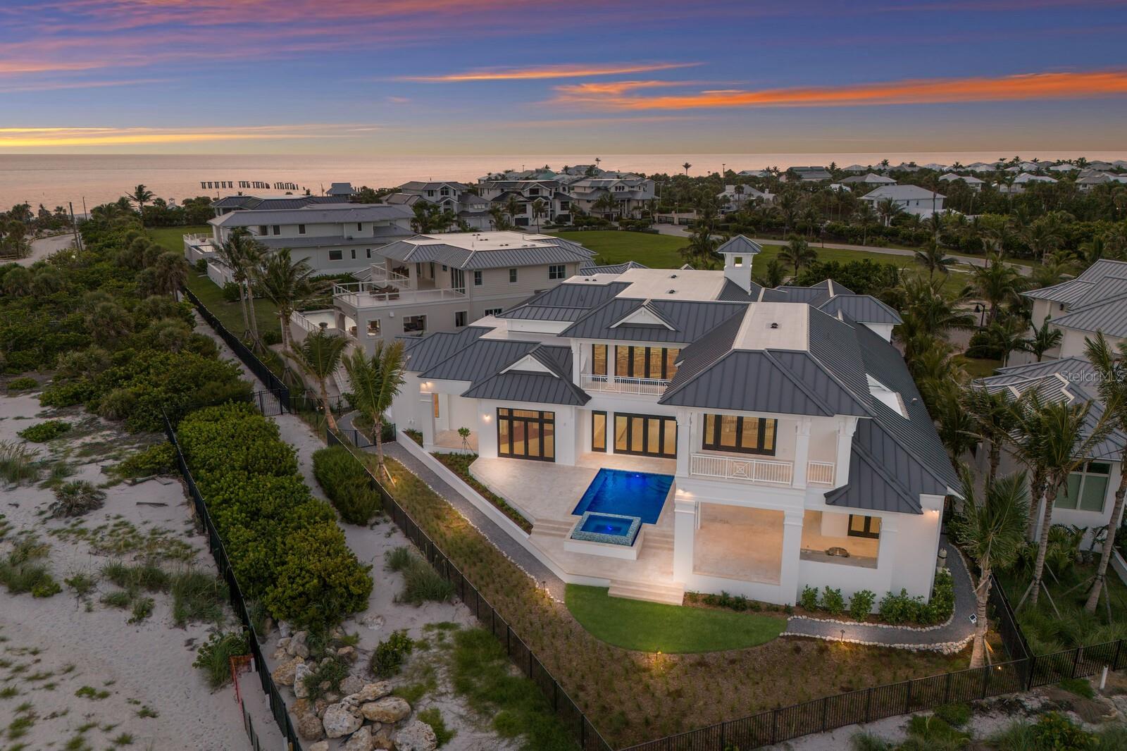 Under Construction. Brand New Construction Now Complete***Quite possibly the most unique waterfront location ever offered for sale in Southwest Florida! Sunrises and Sunsets will be enjoyed here in the winter months together with 180 degrees of Gulf to Bay cerulean waterscape, pristine beaches, nostalgic lighthouse view, and the Historic Boca Grande Pass – AKA ‘The Tarpon Capital of the World’! This exquisite BCB Homes custom built estate offers 8,100 square feet of living space and nearly 3,000 square feet of additional outdoor & garage accommodations. The generous floor plan headlines two magnificent Master / VIP mega suites which is a must see even for the most selective Buyer along with three additional luxurious bedroom ensuites, and a bonus room with full bath that could serve as the sixth guest quarters. In addition, the home showcases a waterfront club room for entertaining, an elegant dining room with decorative ceiling details, and the captivating Sea Watch lounge on second level overlooking the heart of Boca Grande Pass. The well appointed kitchen and family room combination will certainly be a popular gathering place offering panoramic water views and convenient access to the outdoor lanai, pool / spa, and waterfront garden. There is also a spacious den conveniently located off the main entry with a picturesque window overlooking the front garden. The interior finishes were thoughtfully selected by owner to ensure the highest of quality. Ruffino custom Maple cabinetry will be presented in nearly every room together with walnut engineered flooring, meticulously hand crafted cypress and poplar wood finished 12 foot + ceilings, Pompeii quartz & quartzite countertops, and hand laid Walker Zanger tile & stone flooring. Other interior selections will include Sub Zero & Wolf appliances, Lutron lighting control / audio surround, and a custom elevator cabin servicing all floors. The outdoor space is exceptional offering 184 feet of water fronting beachscape and direct access to the inclusive East Beach and Pier. Enjoy entertaining and cooking out in your well equipped outdoor kitchen poolside with convenient remote control shutters and bug screens for added protection against all elements. Exterior construction is just as impressive with storm security being the focal point. The all concrete block structure is fortified with Anderson 400 hurricane rated windows and doors together with a hand etched concrete stucco finish for superior strength and durability. Other exterior construction upgrades include remote hurricane rated shutters, Englert standing seam metal roof, and Clopay hurricane rated garage doors. Multiple outdoor terraces will enhance the exterior profile combined with custom decorative shutters, and the prominent Cupola representing the Architects vision of elegance. All current selections and finishes will be available upon serious inquiries. Hill Tide Estates is majestically positioned along the shores of Boca Grande Pass, Charlotte Harbor, and the Gulf of Mexico. The Gated Community features a private tiered beach, and a unique private fishing / observation pier exclusive for the 19 homeowners.