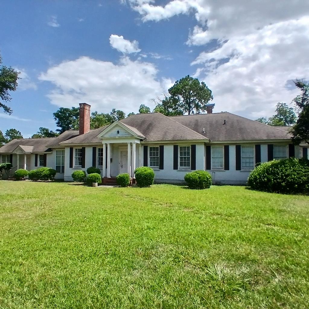 Classic Southern Beauty and Elegance, located in the heart of Pelham Ga. This stately brick home is nestled on 1.31 ac. of lush landscaping, with a newly built wired workshop. Enjoy your very own spa-style lap pool under a screened enclosure. Featuring over 3600+ sq.ft. of space that has 4 bedrooms, 4 baths. and a mother-in-law suite/apt that includes a private entrance and a kitchen. The heart of the home has a spacious kitchen /family room with built in bookcases and large brick wood-burning fireplace. This home has so many features, room,space,charm and quality! Please Call for your personal tour today!