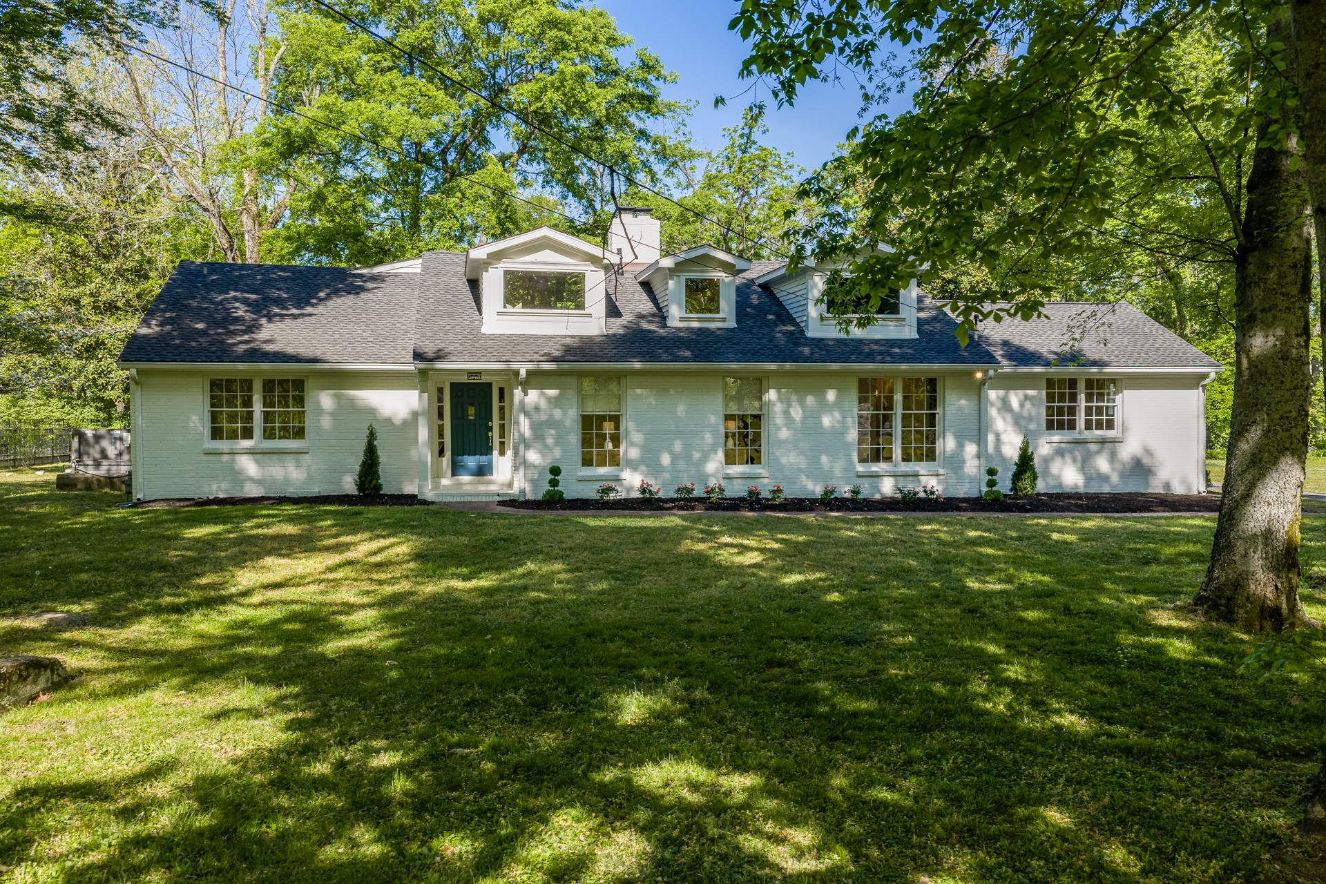 Open House, Saturday 5/9 2-4. Opportunities like this are rare in Green Hills—where privacy, land, and natural features come together in a way that’s nearly impossible to recreate.Set on a uniquely positioned lot, this property offers exceptional seclusion with a private creek tracing the edge of the property, fed by a natural underground spring with roots dating back to the 1700s. The original spring house still marks its location, and the water was previously tested and noted for its exceptional quality, with potential for restoration.The adjacent parcel is restricted from future development, creating a natural buffer that enhances privacy. Thoughtfully maintained with mature trees and native landscaping, the setting feels tucked away—while still being ideally located within approximately one mile of Green Hills shopping and dining, 12 South, Sevier Park, and I-65, with direct access to downtown via Granny White Pike. Ideally positioned with close proximity to Lipscomb Academy and University.Inside, the home is truly turnkey following an extensive renovation and second-story expansion, including updated ductwork, electrical, plumbing, and new drywall throughout much of the home. Wood flooring runs throughout, complemented by fresh paint and 2 gas fireplace. All appliances remain.The main level features a spacious primary suite with soaking tub, walk-in shower, and double vanities, along with a secondary suite with private bath and an additional bedroom with full guest bath.Upstairs offers two bedrooms, a full bath, and a private half bath within one bedroom, along with space prepared for a future soaking tub.The layout supports multi-generational living or flexible use, with additional potential to elevate the home for added space and garage capacity (buyer to verify).Seller offering $25,000 credit toward crawl space encapsulation.